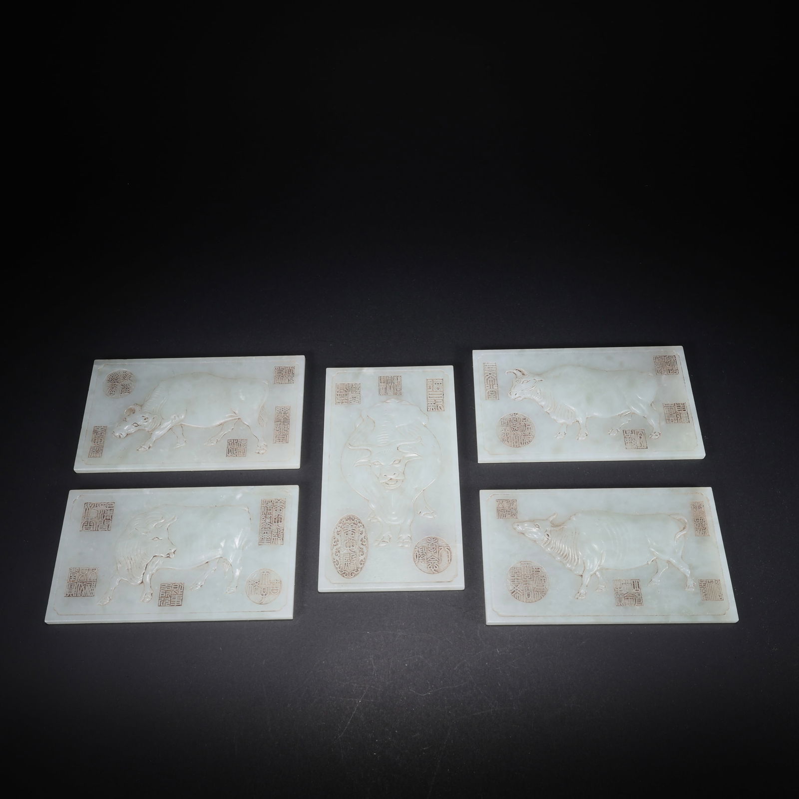 A HETIAN JADE SET OF FIVE CATTLE JADE TABLETS CARVED WITH POETRY: Hetian Jade Set of Five Cattle Jade Tablets Carved with Poetry