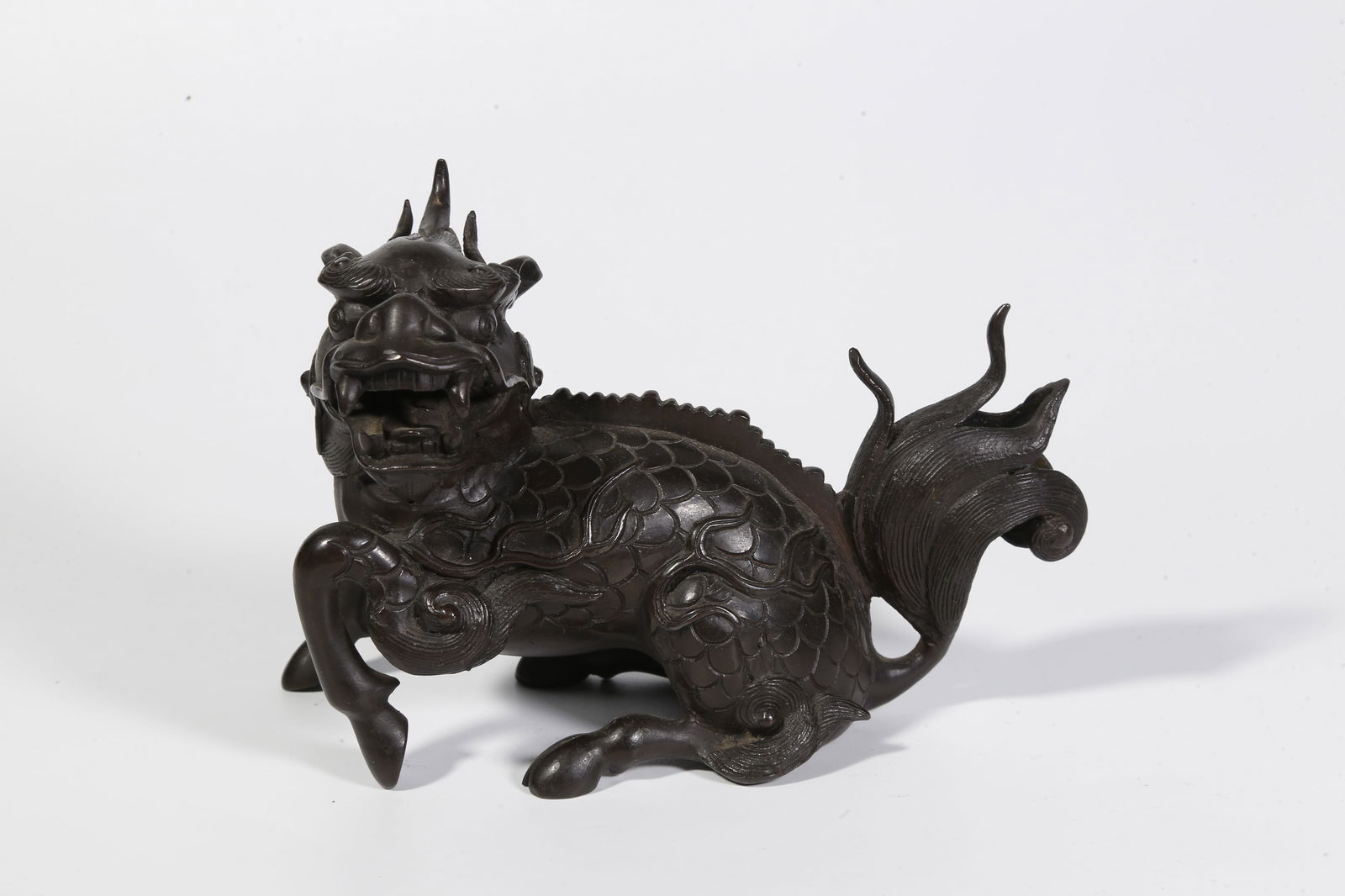 A BRONZE QILIN-SHAPED ORNAMENT (1 of 9)