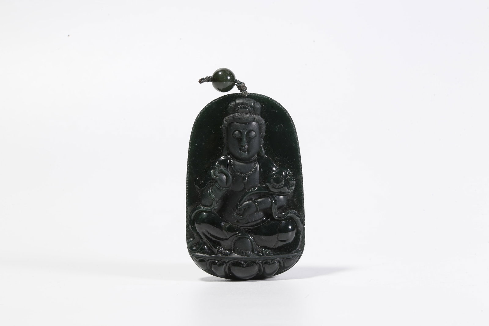 A HETIAN JADE PLAQUE WITH BUDDHA MOTIF: Hetian jade plaque with Buddha motif