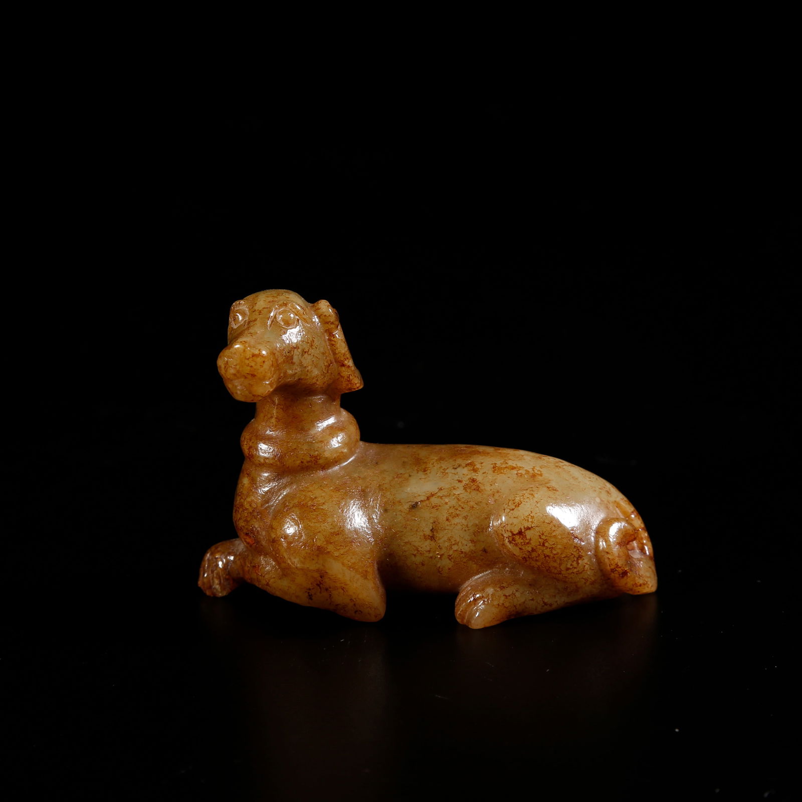 A HETIAN JADE DOG-SHAPED ORNAMENT (1 of 10)