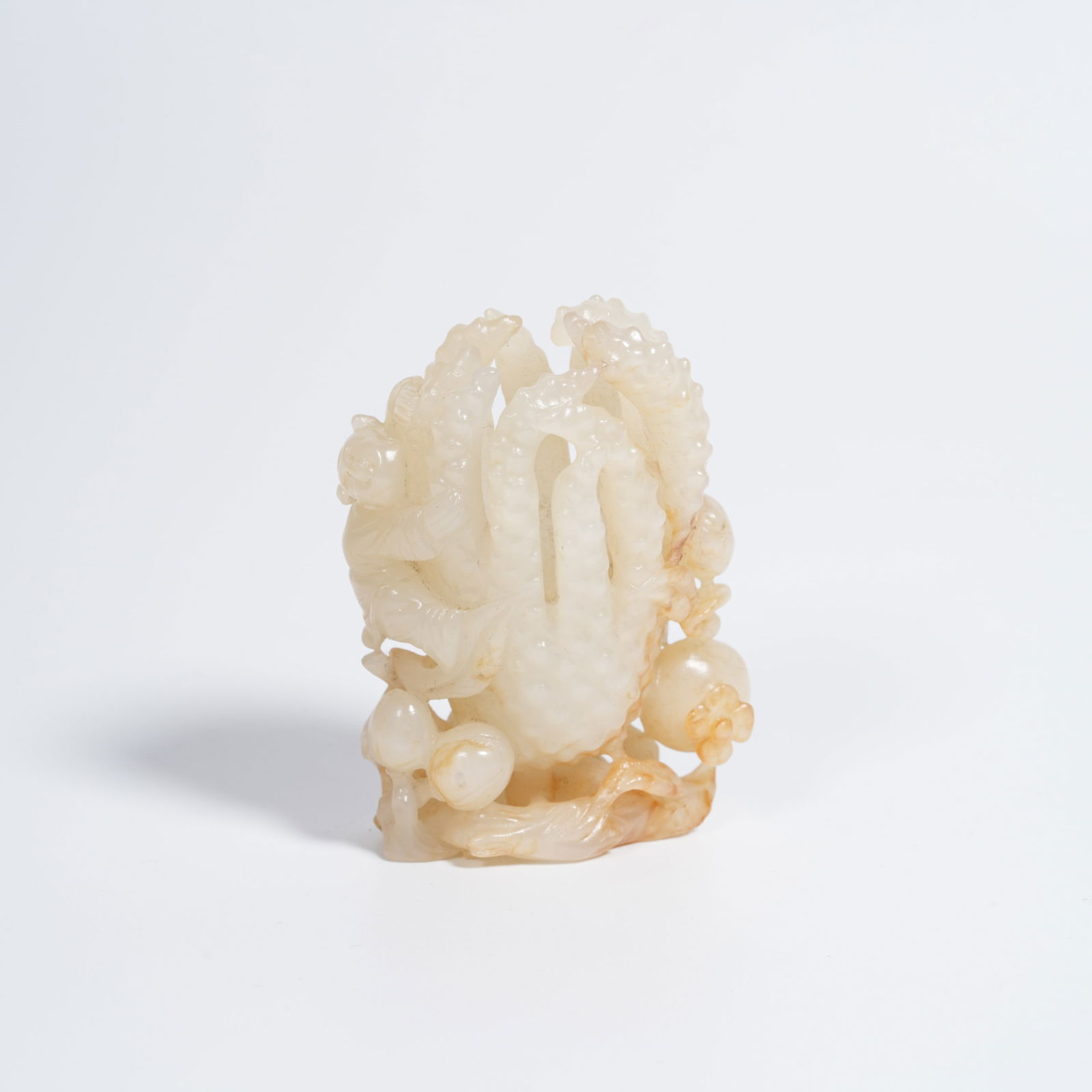 A HETIAN JADE BUDDHA'S-HAND CITRON PENDANT: Hetian jade Buddha's-hand citron pendant