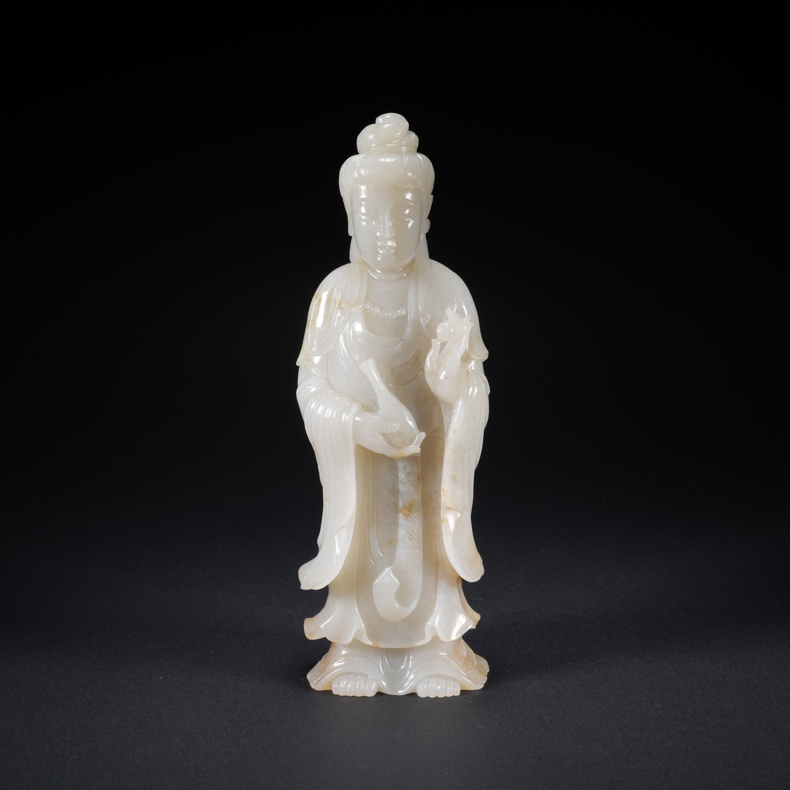 A HETIAN JADE CARVED STANDING GUANYIN FIGURE: Hetian Jade Carved Standing Guanyin Figure