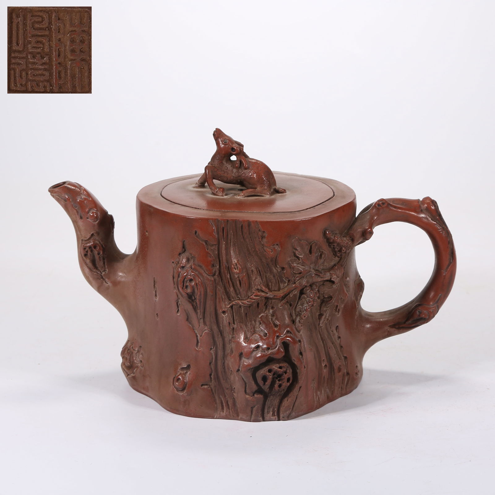 A YIXING (ZISHA) TEAPOT CARVED WITH BURL PATTERN: Yixing (zisha) teapot carved with burl pattern