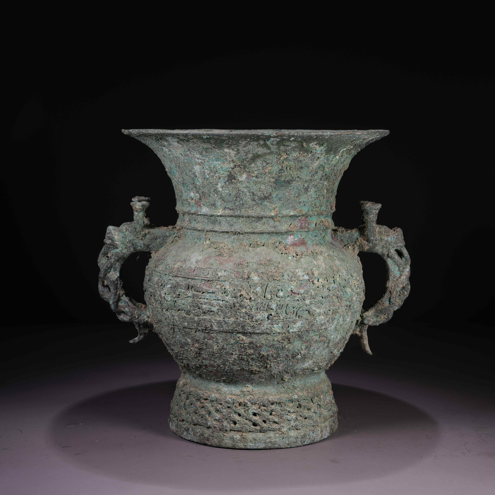 A BRONZE ZUN VESSEL WITH BEAST-HEAD HANDLES: Bronze Zun Vessel with Beast-Head Handles