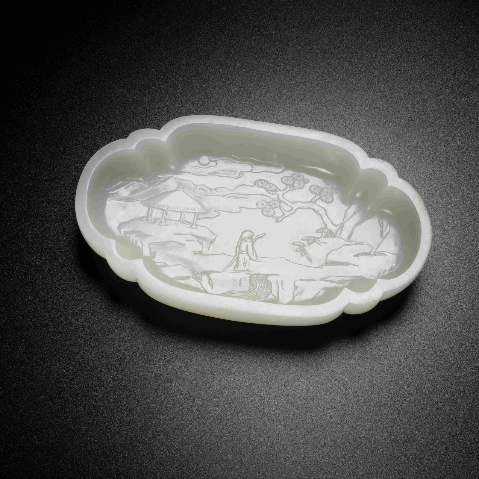 A HETIAN JADE INCISED SCHOLAR UNDER PINE SCENE WASH: Hetian Jade Incised Scholar under Pine Scene Wash