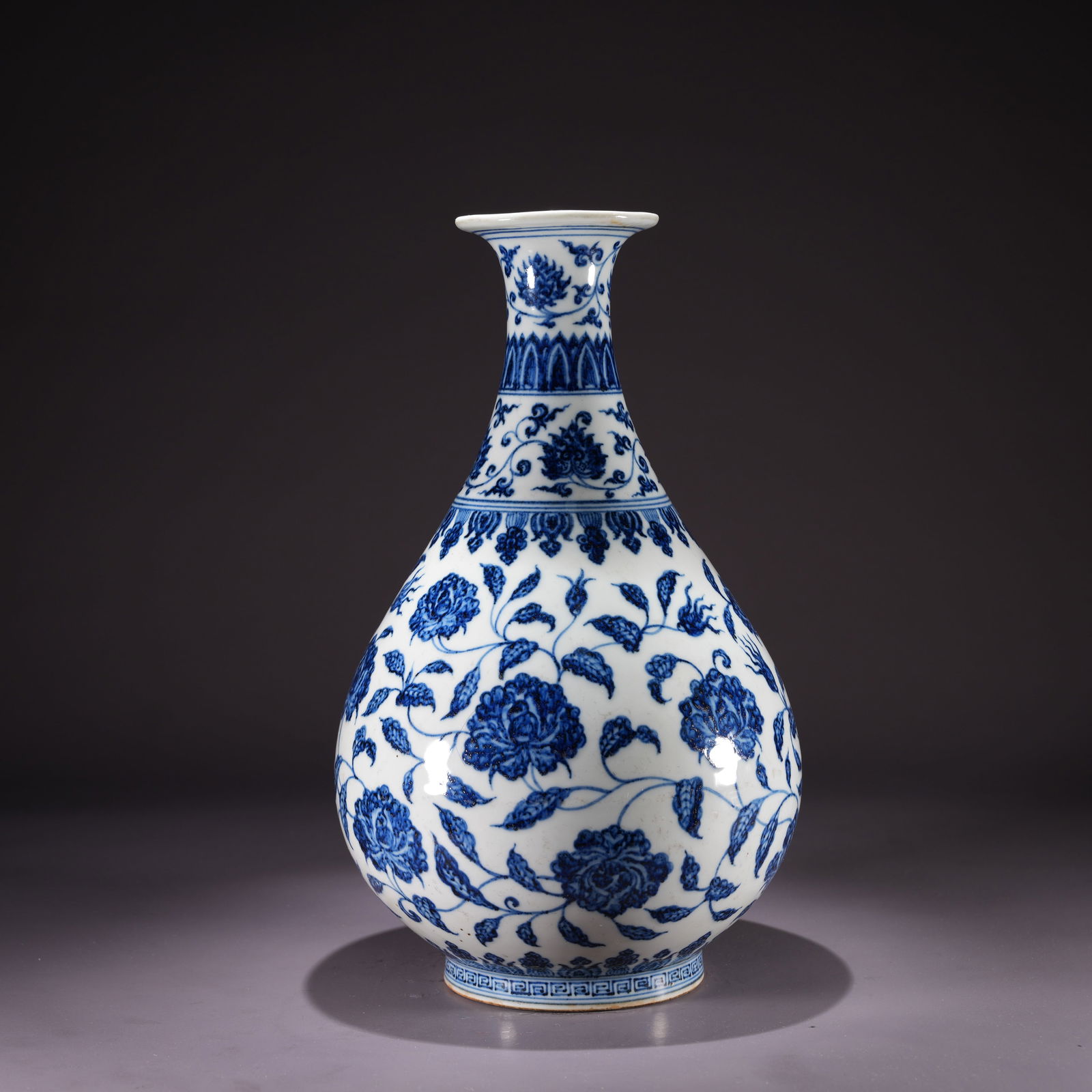 A BLUE-AND-WHITE YUHUCHUN VASE WITH FLORAL SCROLL MOTIF: Blue-and-White Yuhuchun Vase with Floral Scroll Motif