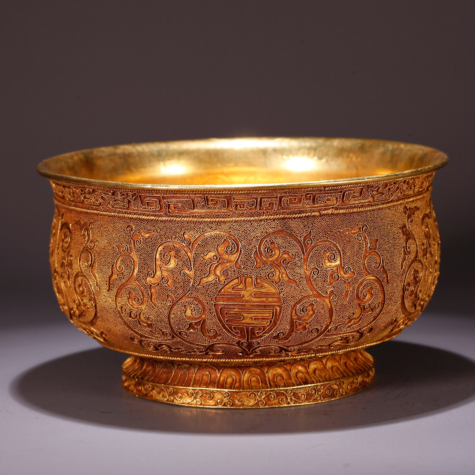 A GILT BRONZE BOWL WITH SHOU CHARACTER PATTERN: Gilt Bronze Bowl with Shou Character Pattern