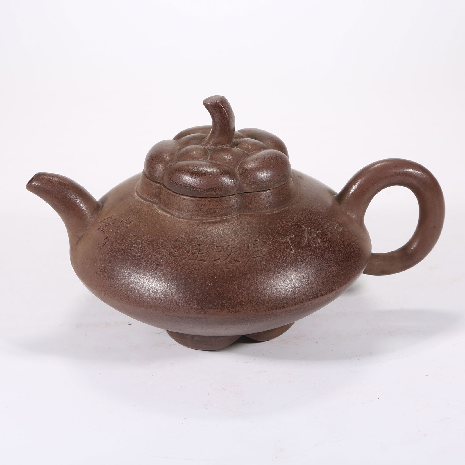A YIXING (ZISHA) TEAPOT ENGRAVED WITH POEM: Yixing (zisha) teapot engraved with poem