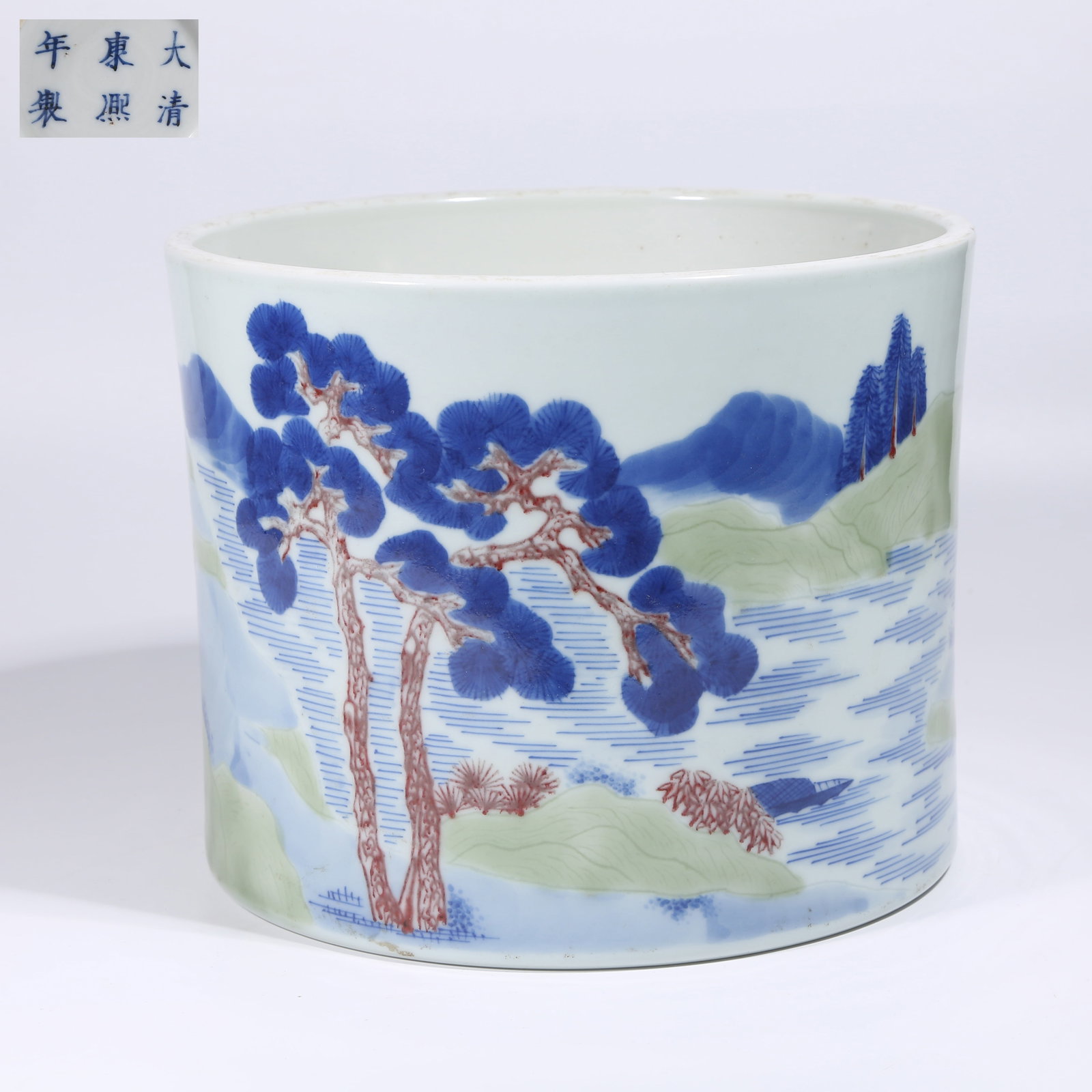 A UNDERGLAZE SANCAI LANDSCAPE BRUSH POT: Underglaze Sancai Landscape Brush Pot