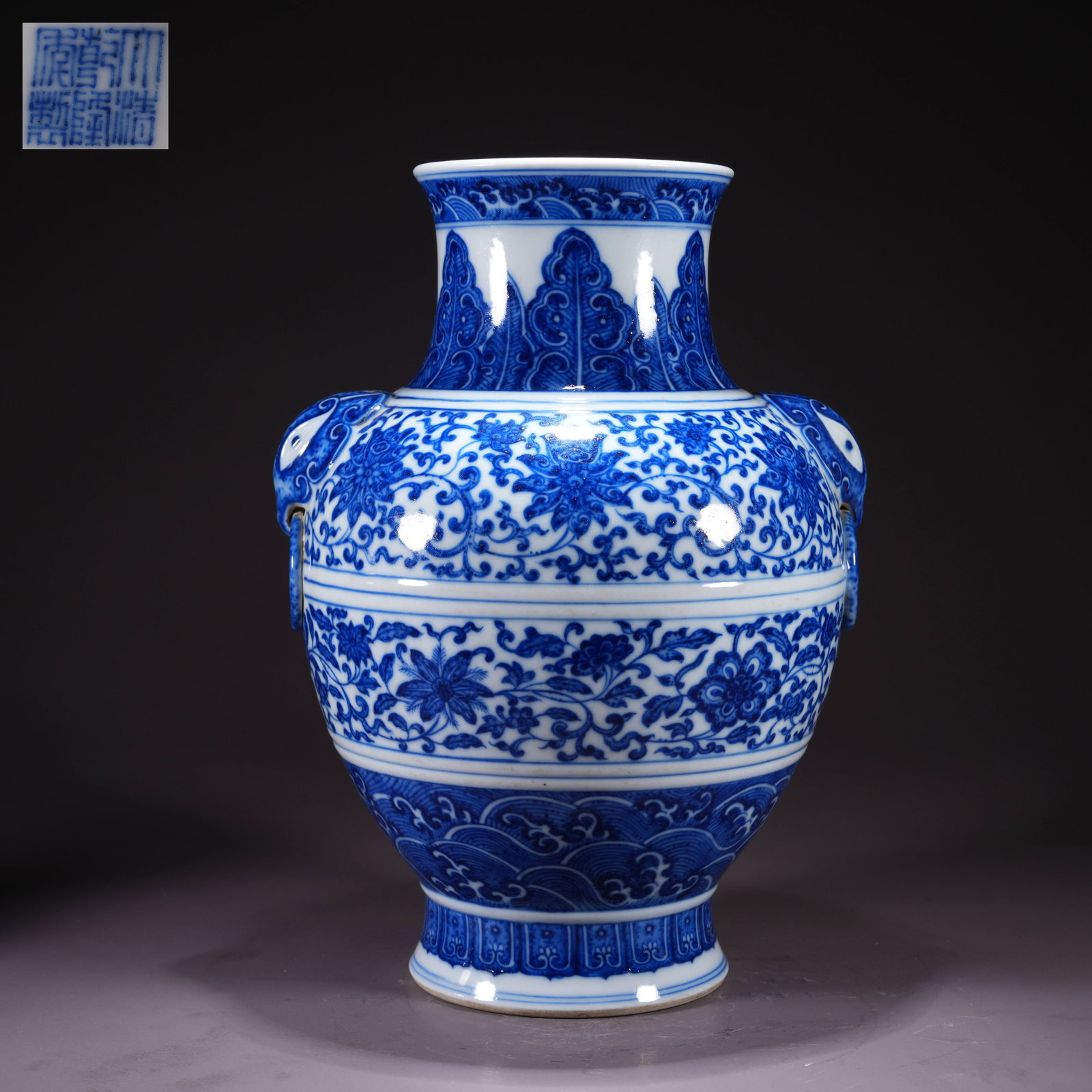 A BLUE-AND-WHITE HU VESSEL WITH FLORAL SCROLL AND RING-HANDLED SPOUT: Blue-and-White Hu Vessel with Floral Scroll and Ring-Handled Spout