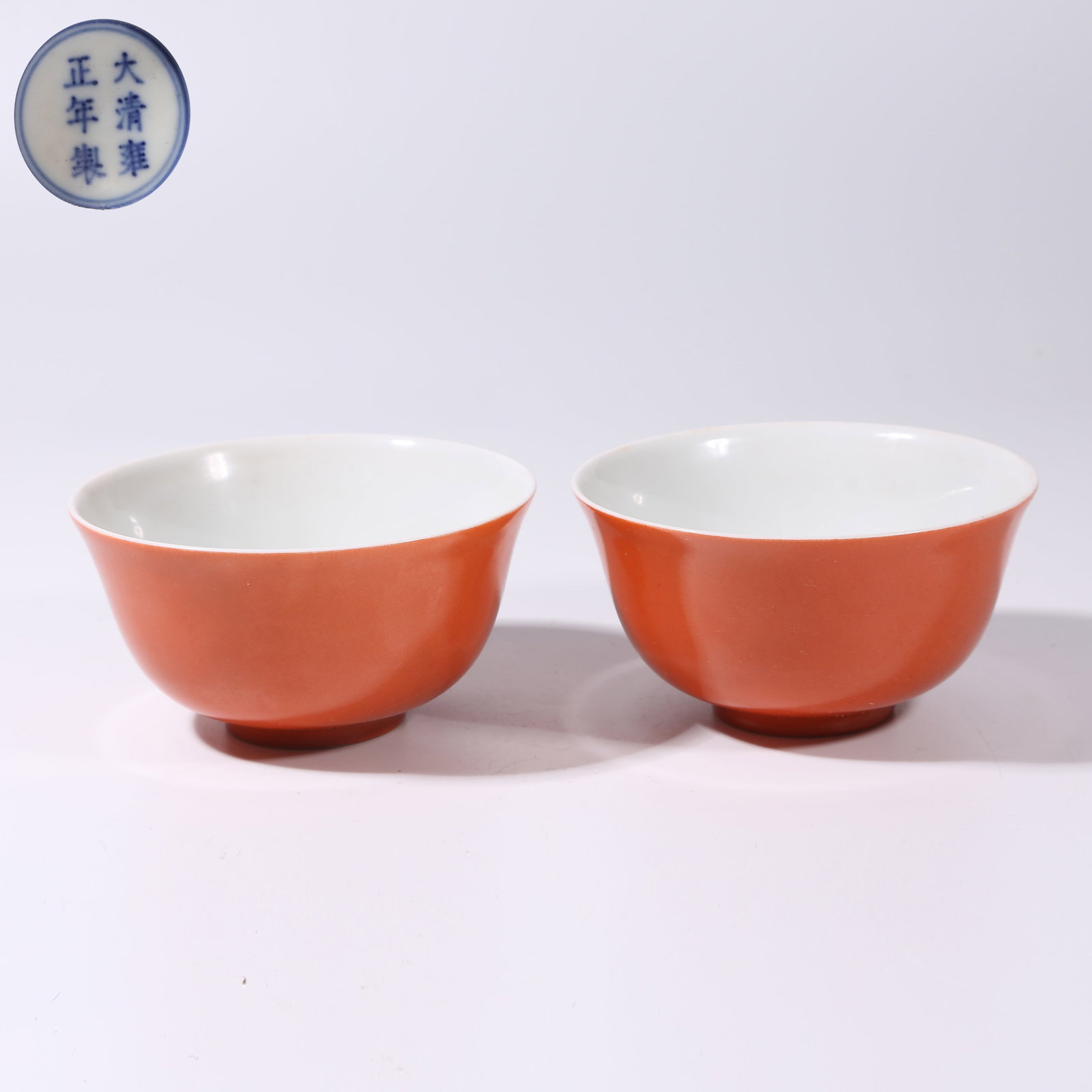 A SET OF CORAL-RED GLAZE CUPS: Set of Coral-Red Glaze Cups