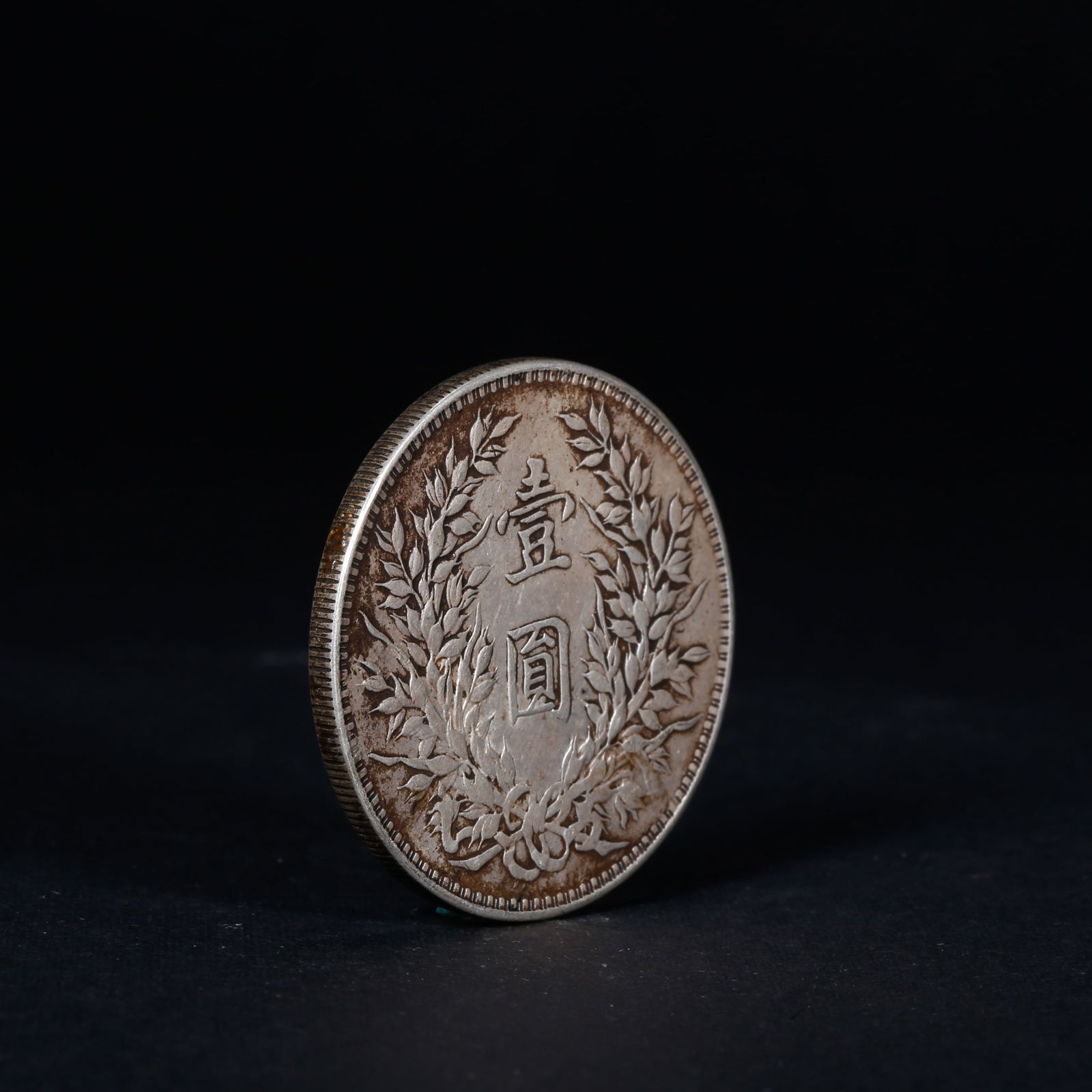 A SILVER DOLLAR COIN - 3