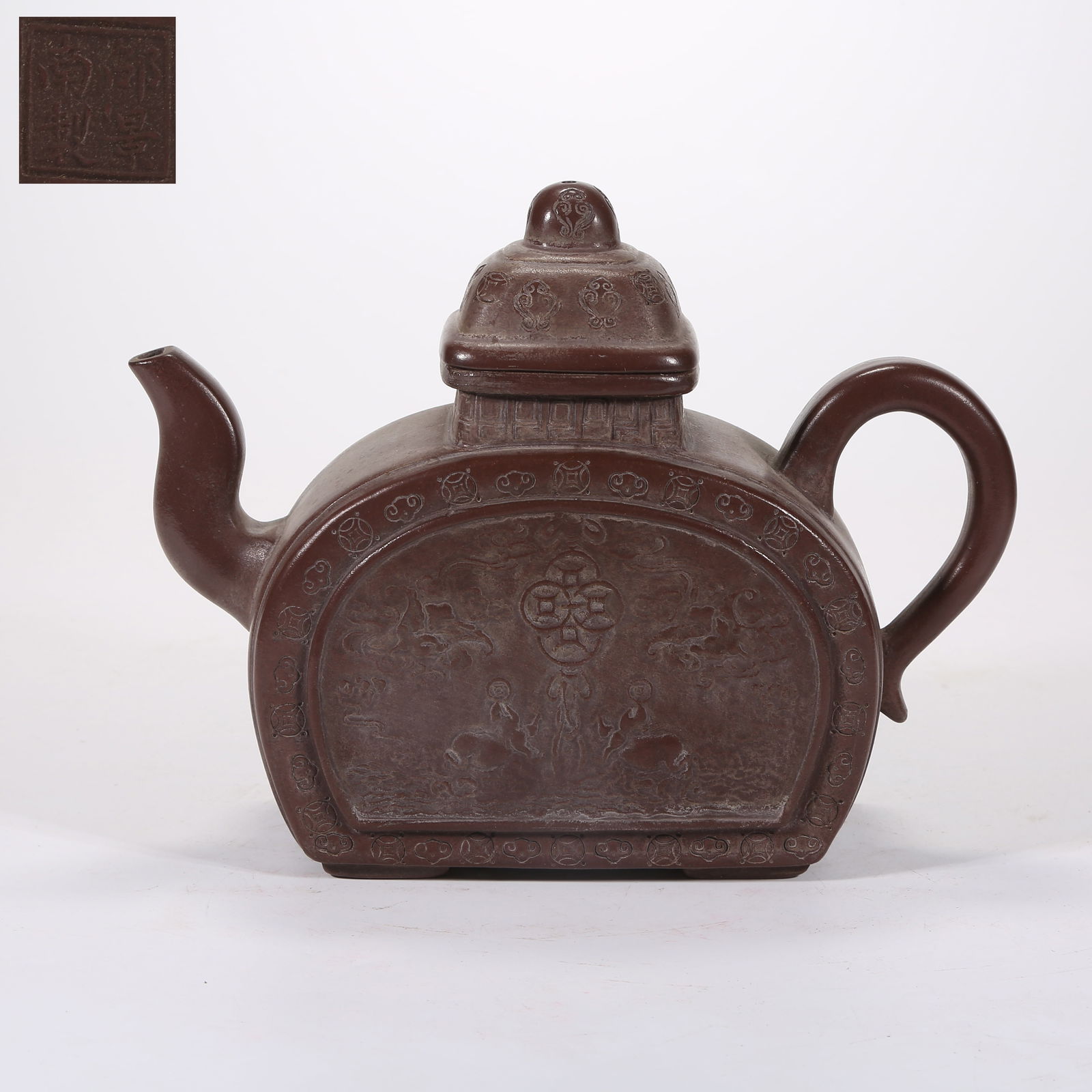 A YIXING (ZISHA) TEAPOT CARVED WITH BLESSINGS-AND-LONGEVITY PATTERN: Yixing (zisha) teapot carved with blessings-and-longevity pattern
