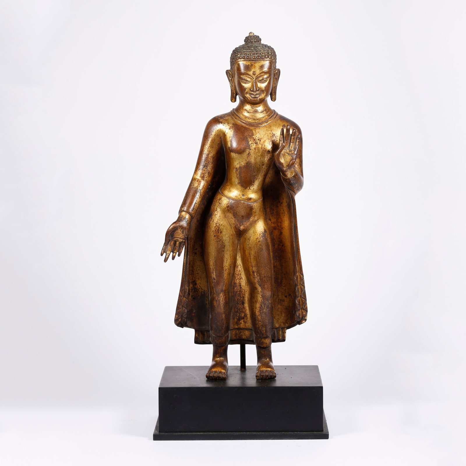 A GILT BRONZE STANDING BUDDHA STATUE: Gilt Bronze Standing Buddha Statue