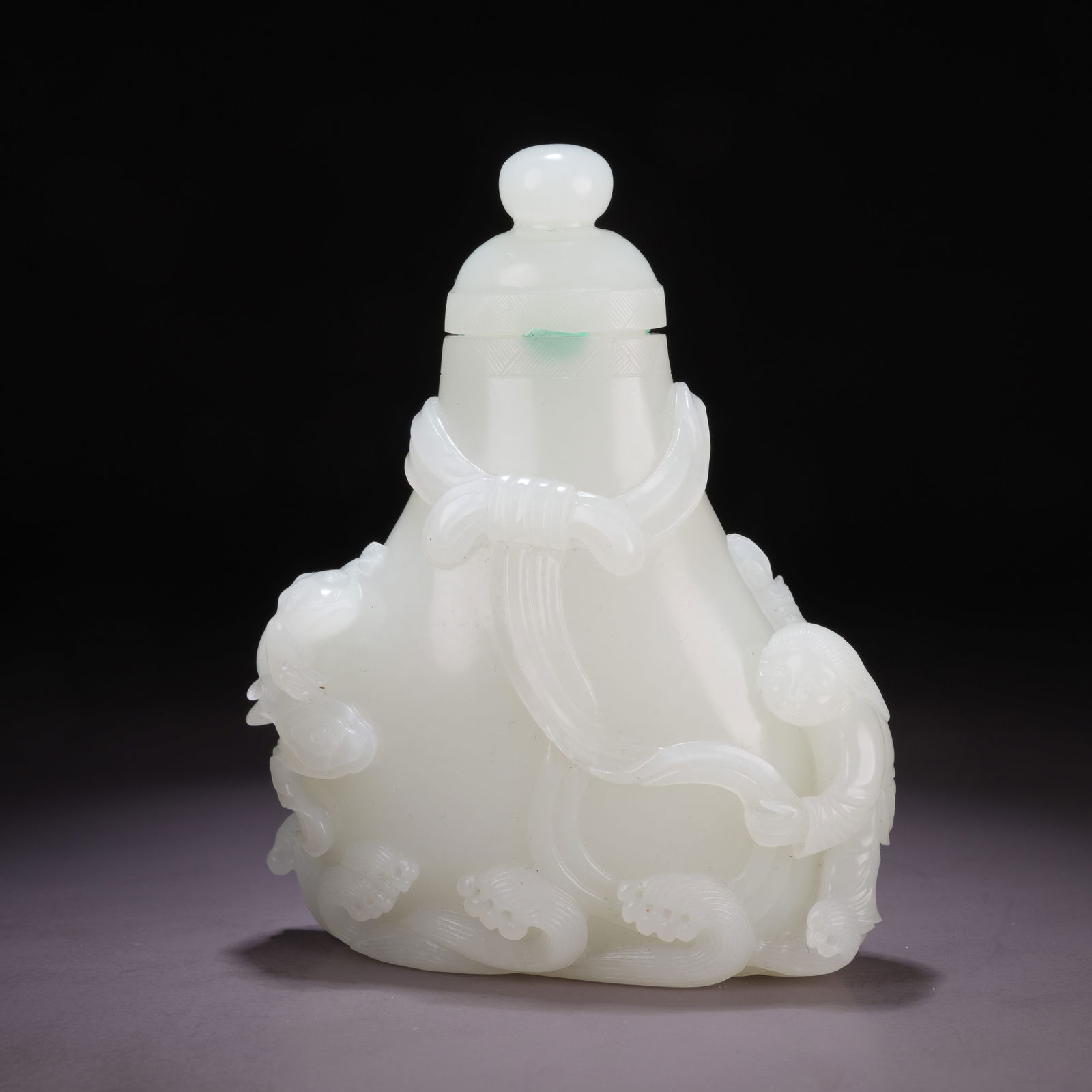 A HETIAN WHITE JADE VASE WITH BOY-AND-BUNDLE MOTIF: Hetian White Jade Vase with Boy-and-Bundle Motif