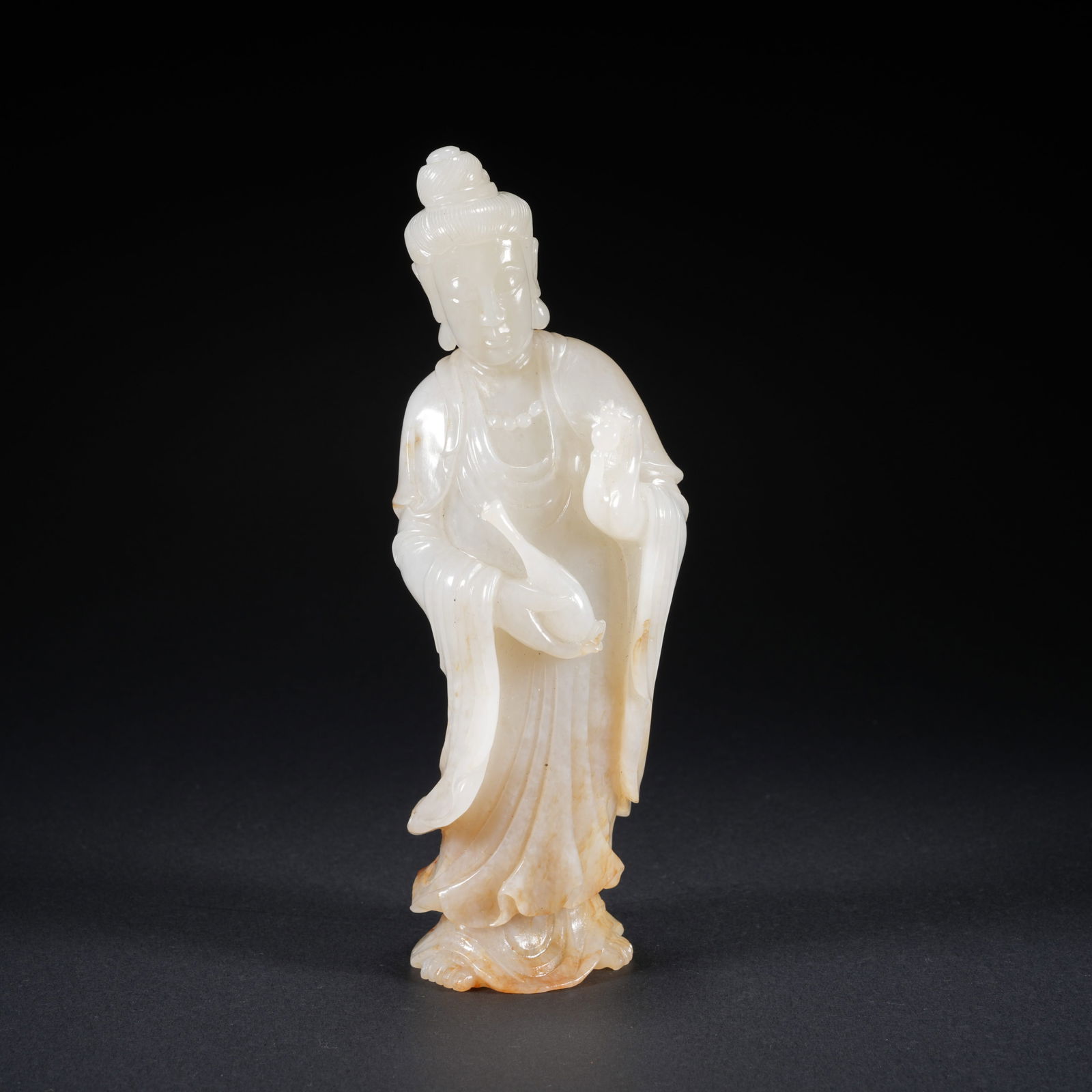 A HETIAN JADE CARVED GUANYIN FIGURE (1 of 9)