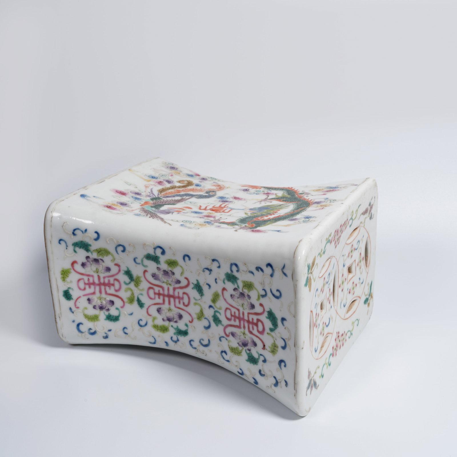 A FAMILLE-ROSE DRAGON-AND-PHOENIX PILLOW: Famille-rose dragon-and-phoenix pillow