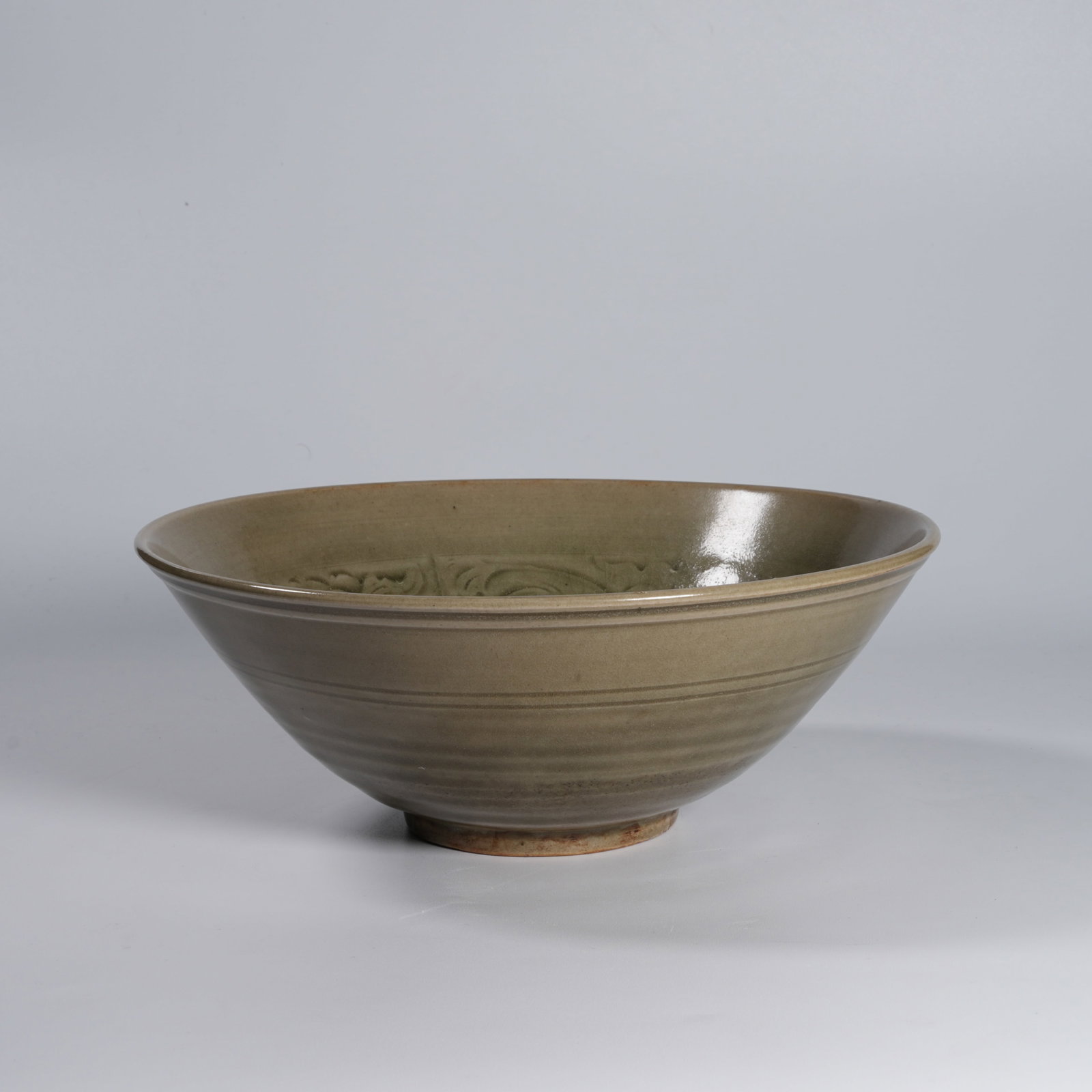 A YAOZHOU WARE LOTUS-AND-CHILD BOWL: Yaozhou ware lotus-and-child bowl
