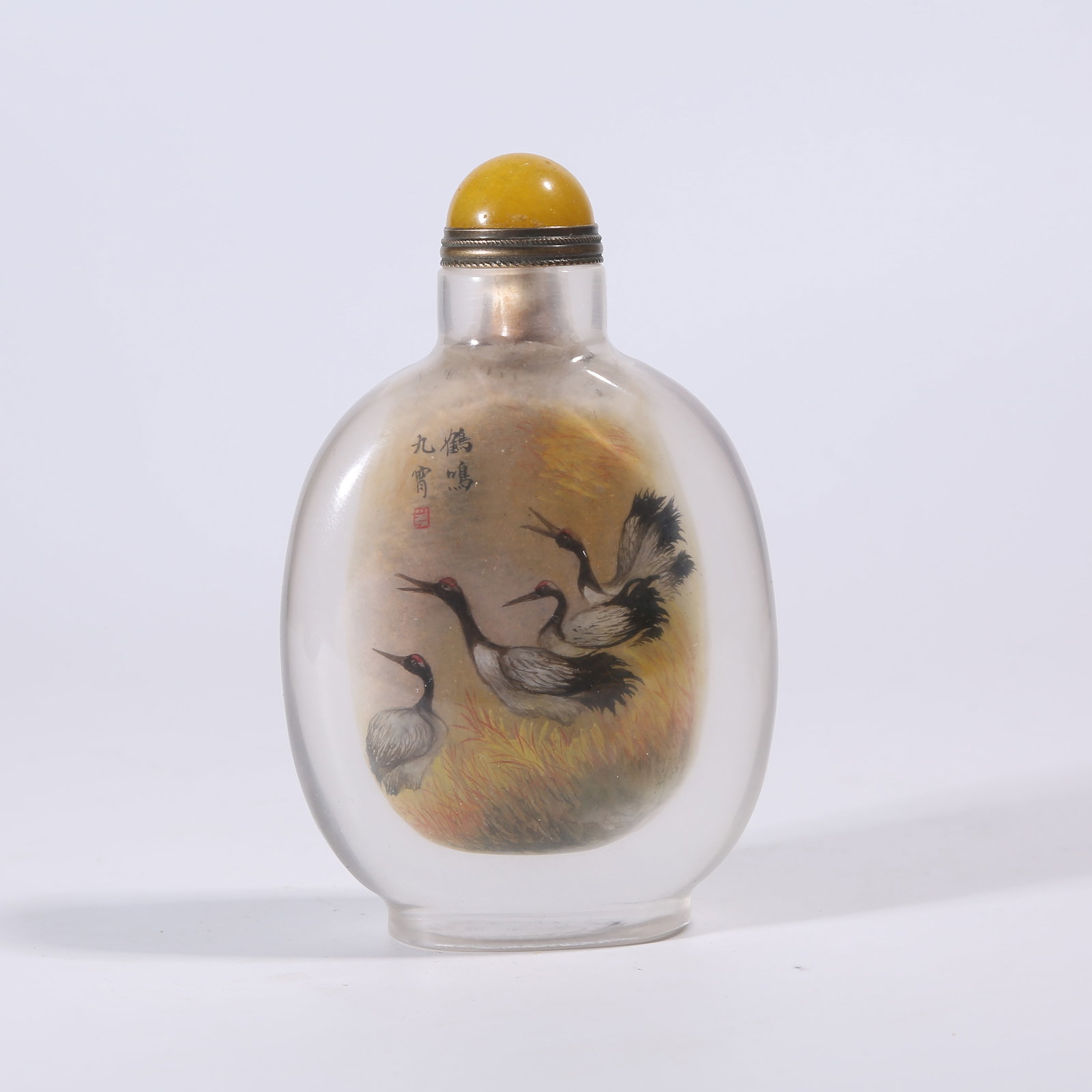A ROCK CRYSTAL INSIDE-PAINTED "CRANE CALLING TO THE NINE HEAVENS" SNUFF BOTTLE: Rock Crystal Inside-Painted "Crane Calling to the Nine Heavens" Snuff Bottle
