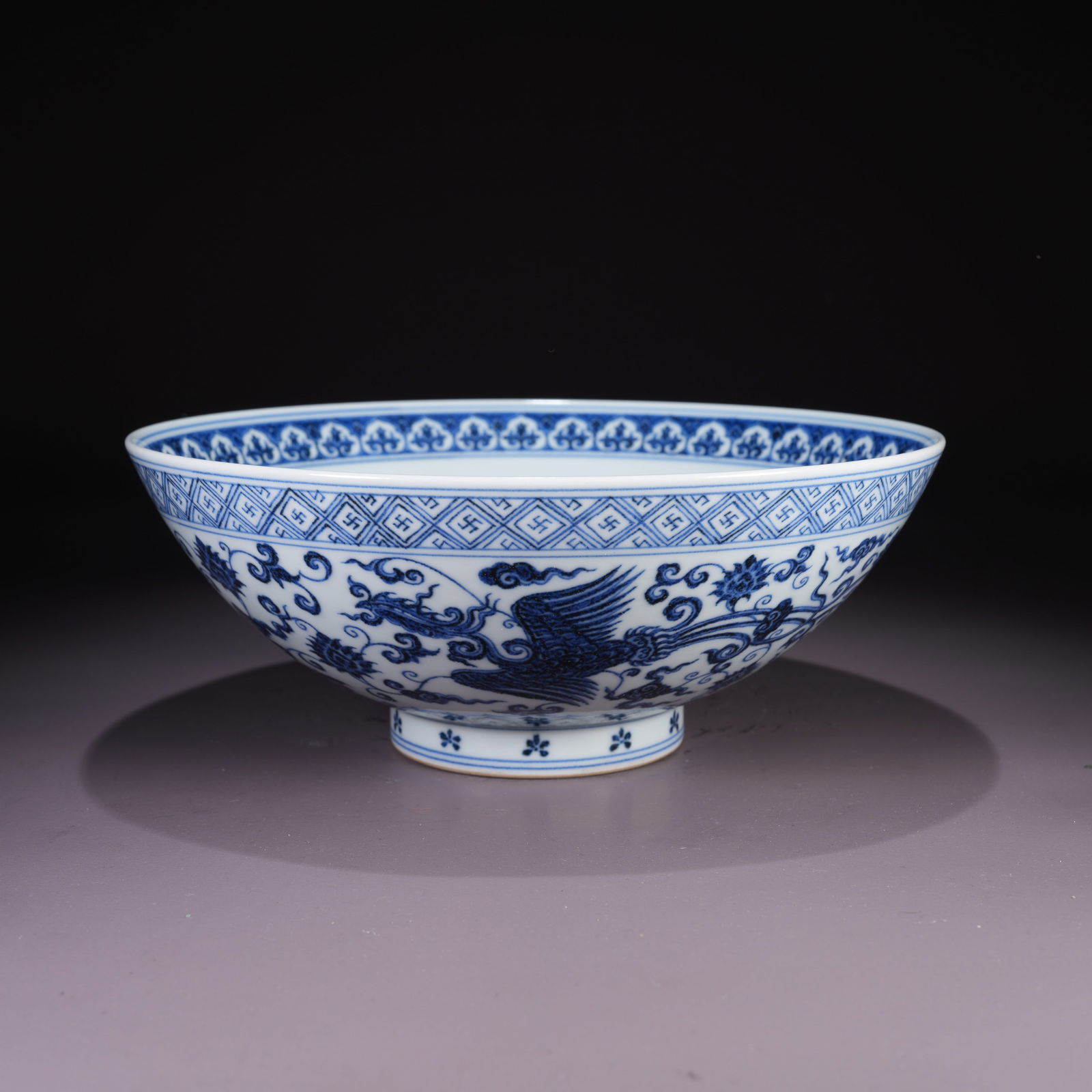 A LARGE BLUE-AND-WHITE BOWL WITH PHOENIX AMONG FLOWERS MOTIF (1 of 10)