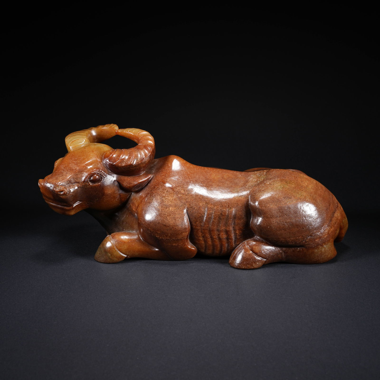 A HETIAN JADE CARVED OX-FORM FIGURE: Hetian Jade Carved Ox-Form Figure