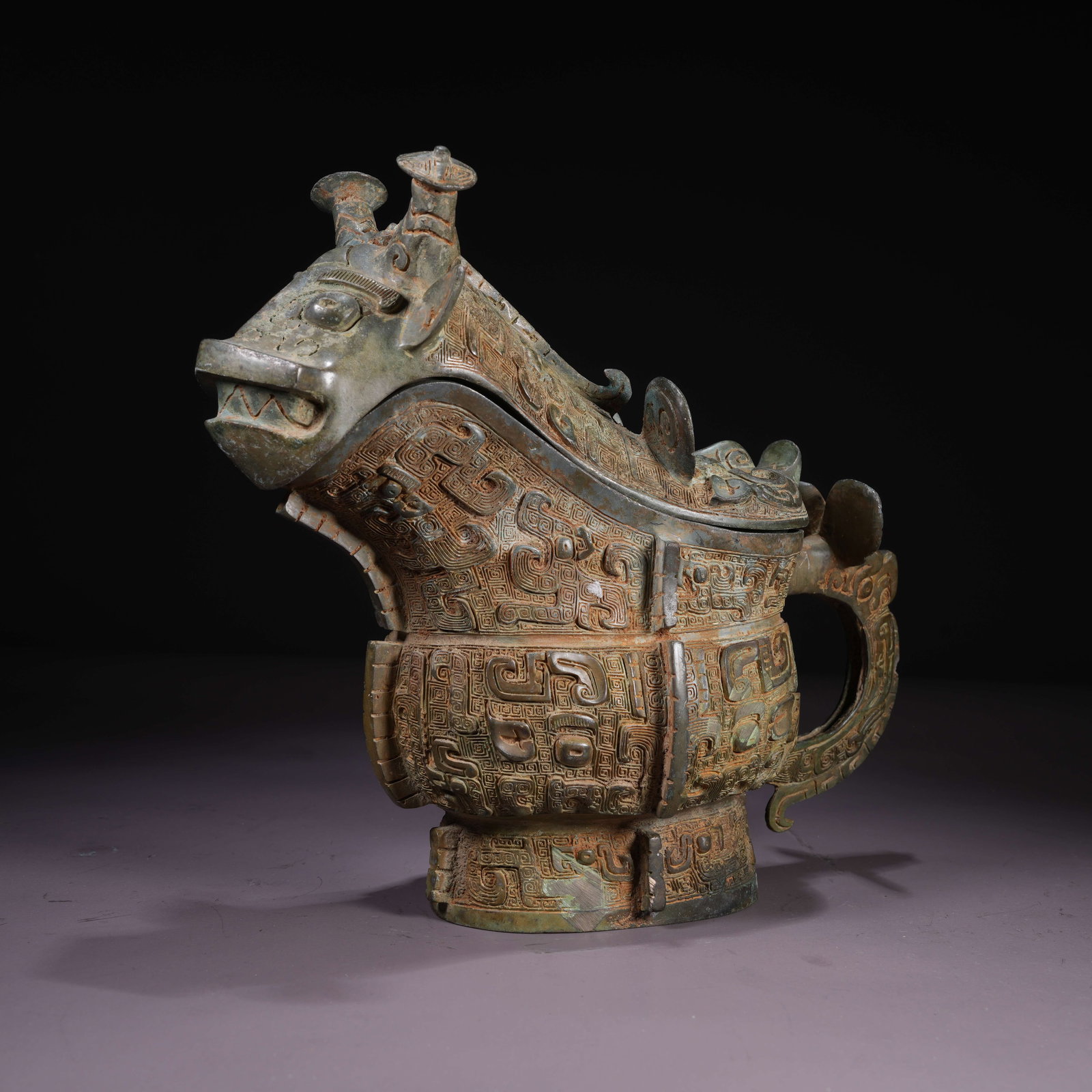 A BRONZE GONG VESSEL WITH TAOTIE MASK: Bronze Gong Vessel with Taotie Mask