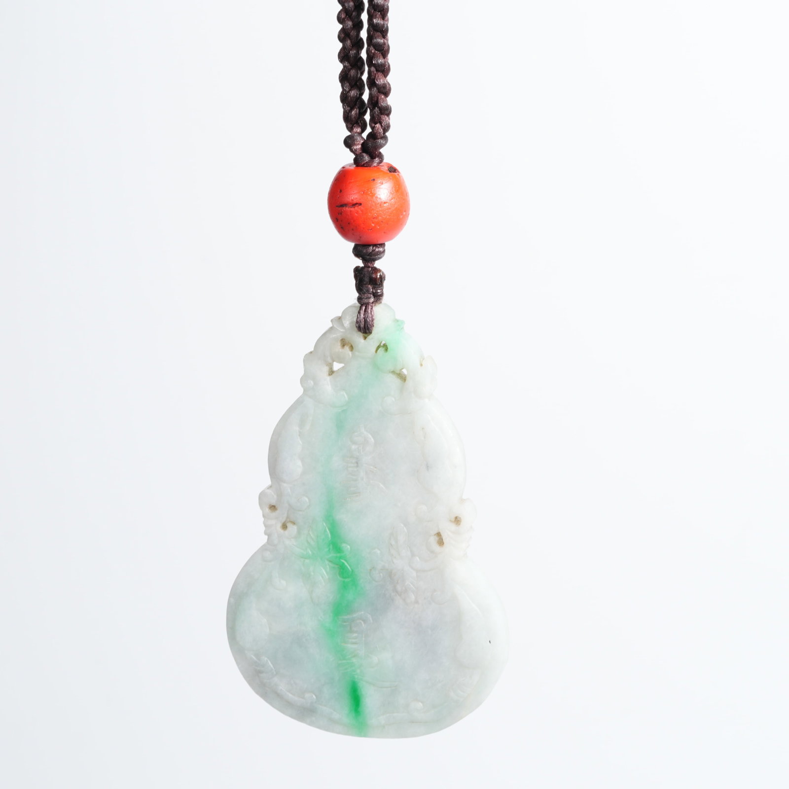 A JADEITE GOURD-SHAPED FASTING PLAQUE: Jadeite gourd-shaped fasting plaque