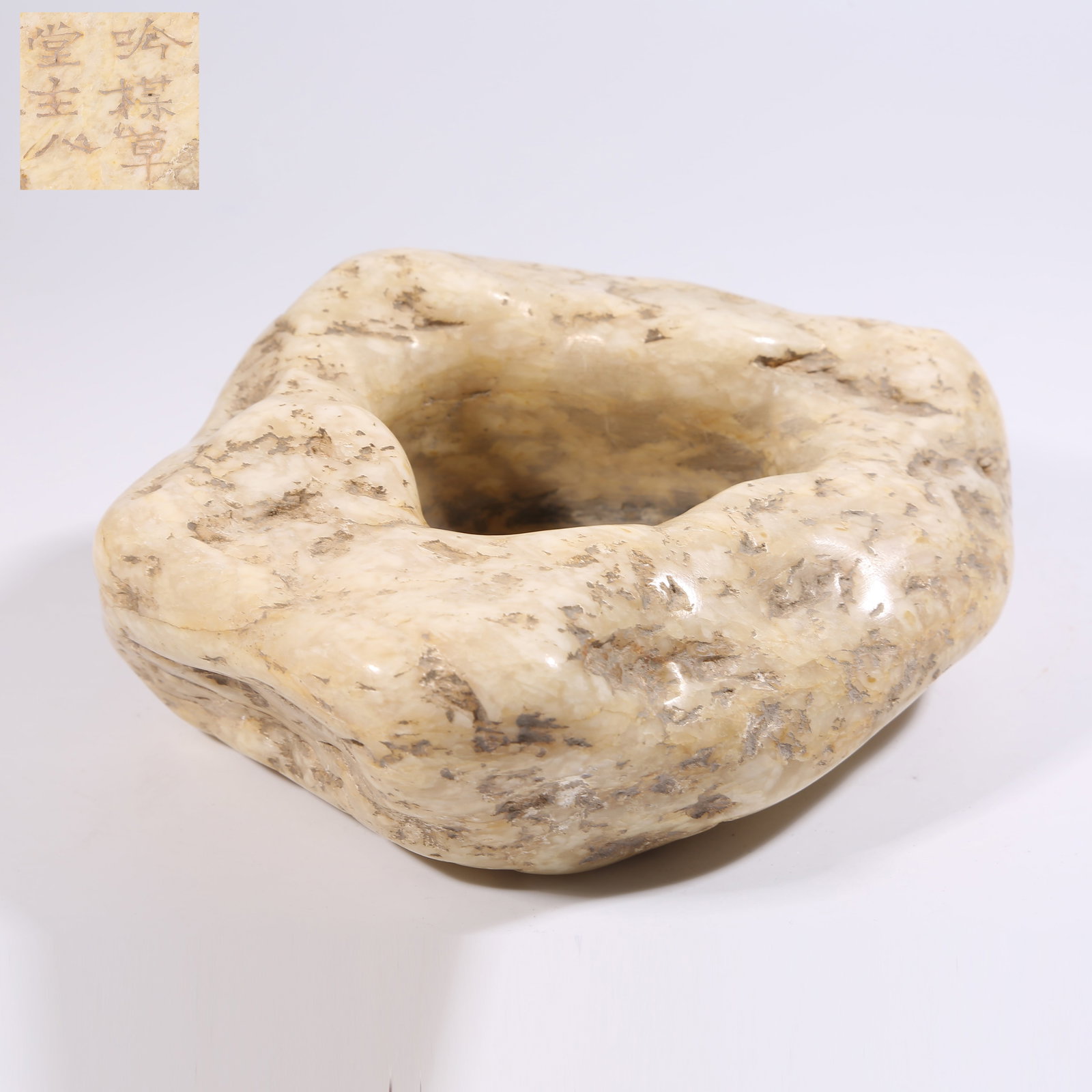 A STONE WATER BASIN: Stone water basin