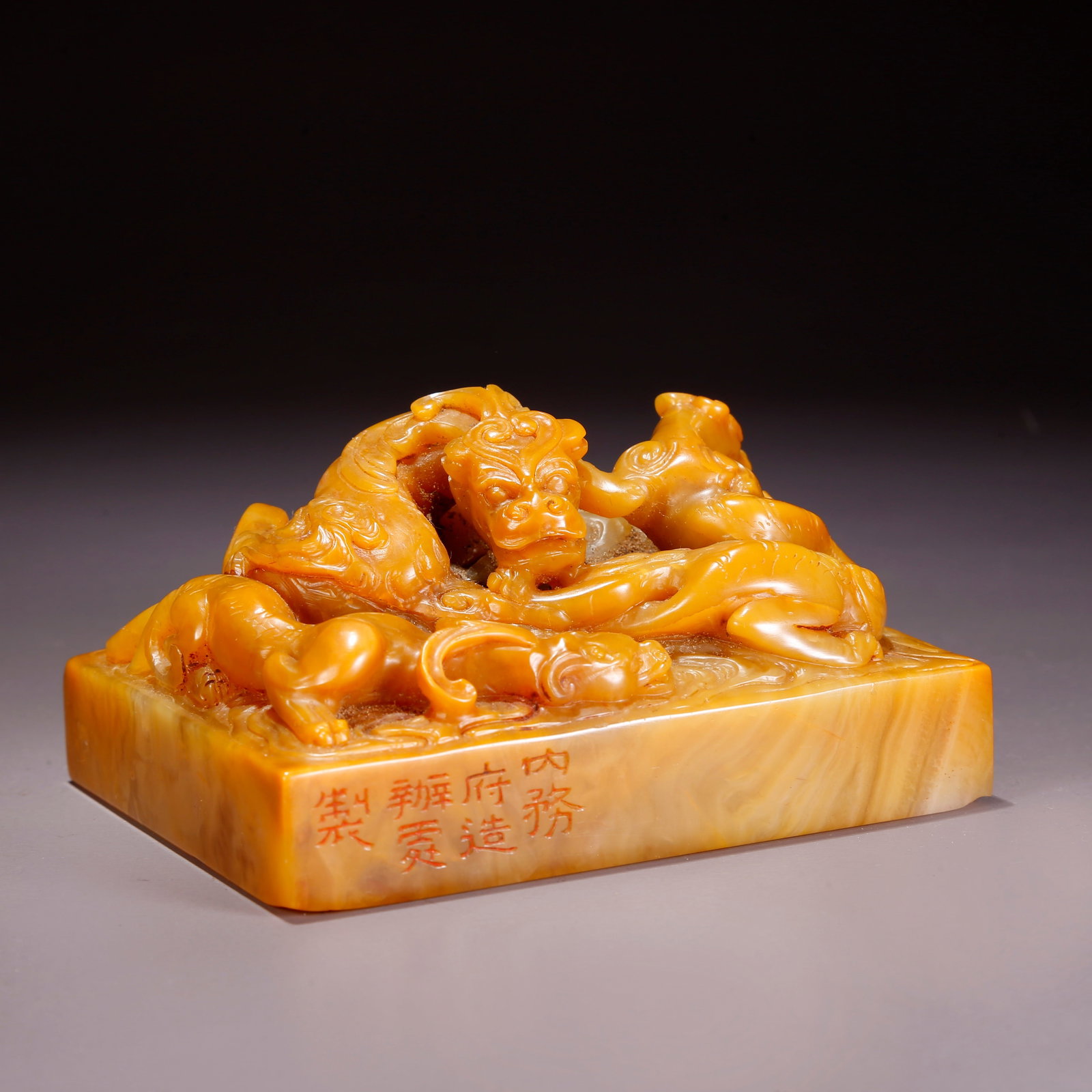 A SHOUSHAN TIANHUANG STONE SEAL WITH THREE DRAGONS MOTIF: Shoushan Tianhuang Stone Seal with Three Dragons Motif