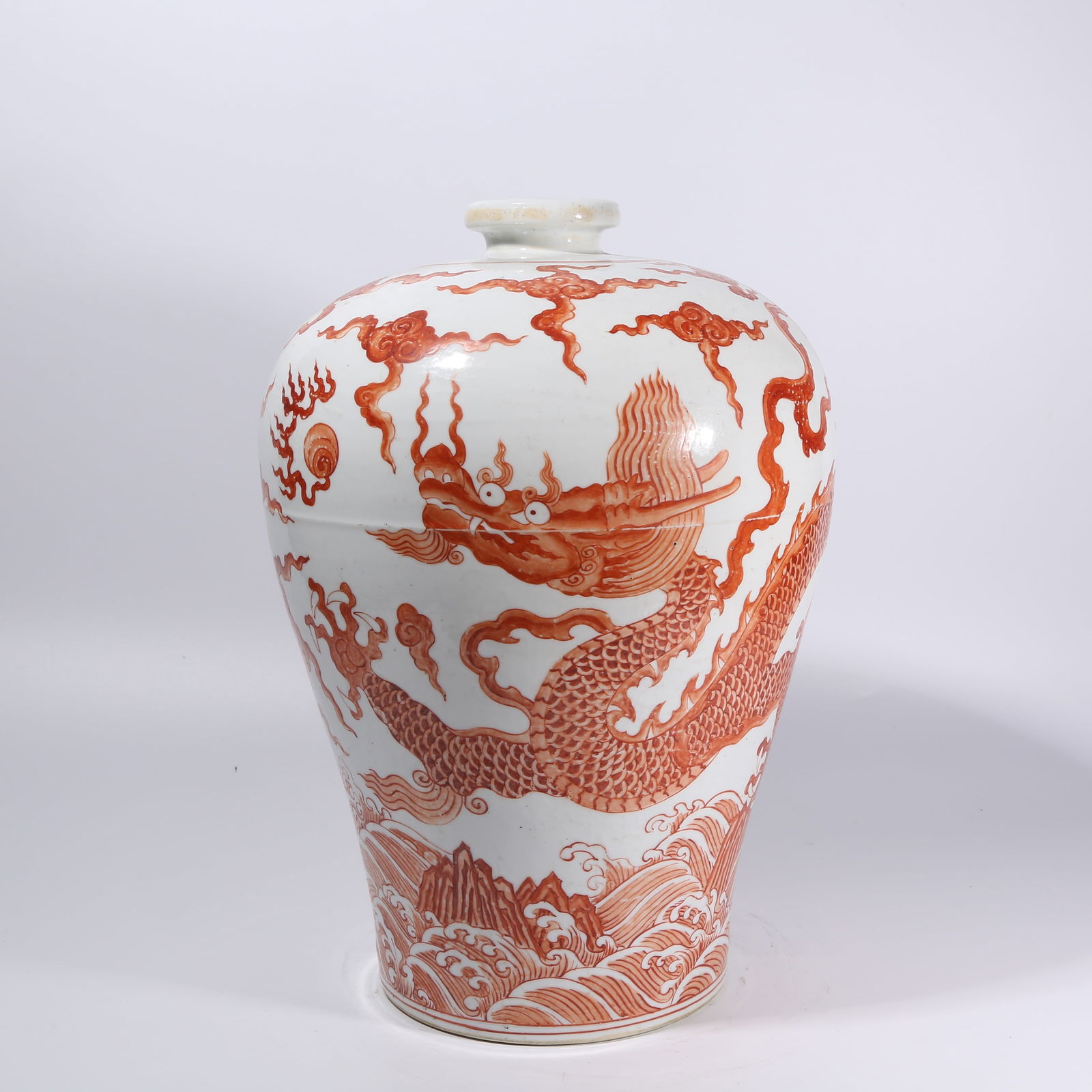 A UNDERGLAZE RED SEA DRAGON CHASING PEARL MEIPING: Underglaze Red Sea Dragon Chasing Pearl Meiping