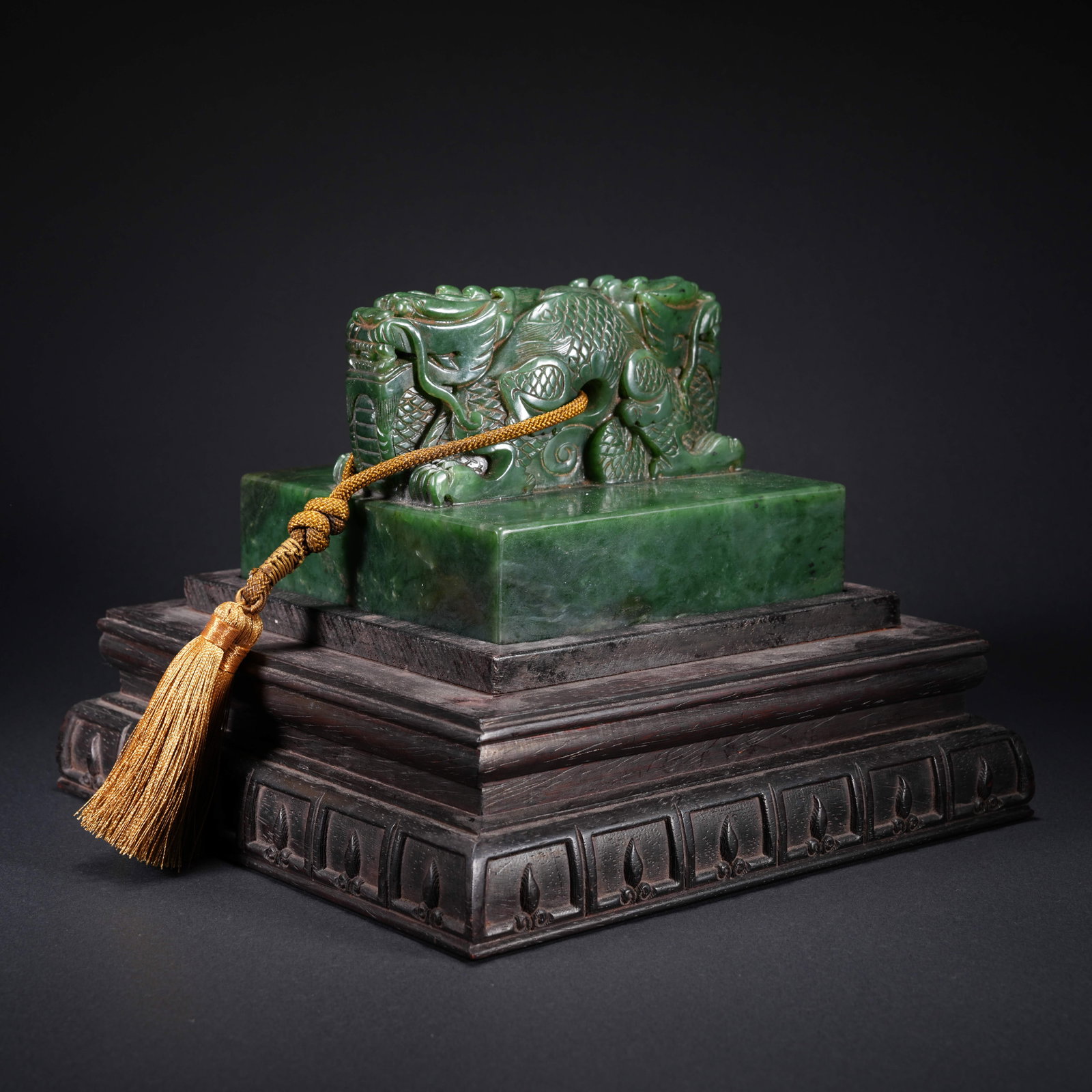 A HETIAN SPINACH GREEN JADE CARVED SEAL WITH DOUBLE-DRAGON FINIAL: Hetian Spinach Green Jade Carved Seal with Double-Dragon Finial