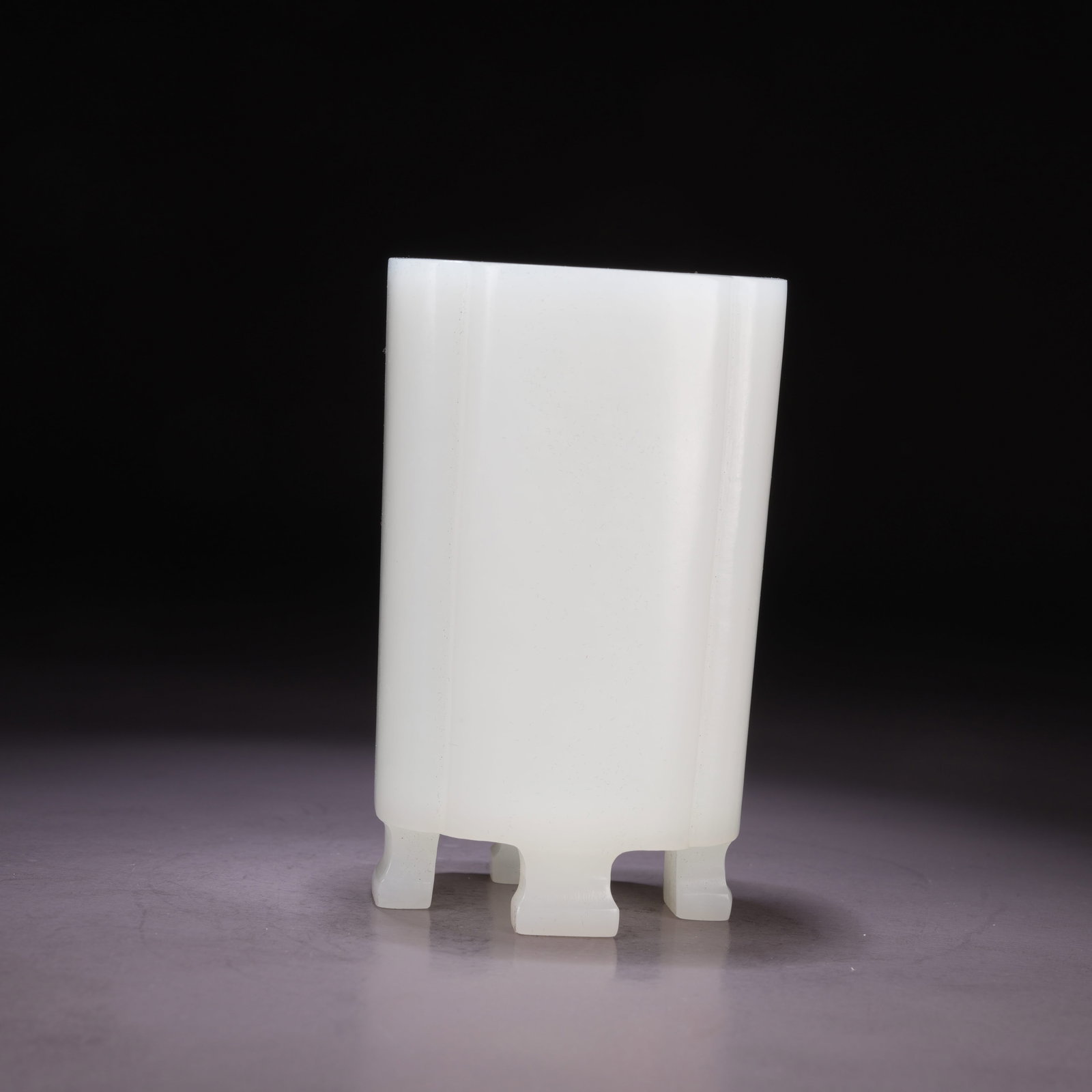 A HETIAN WHITE JADE FOUR-FOOTED SQUARE BRUSH HOLDER WITH CHAMFERED CORNERS: Hetian White Jade Four-Footed Square Brush Holder with Chamfered Corners