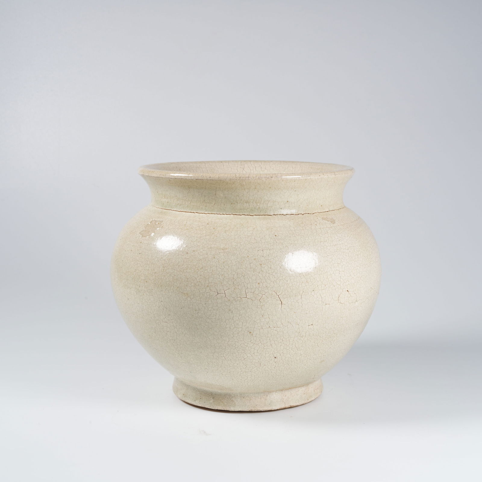 A WHITE-GLAZED JAR - 2