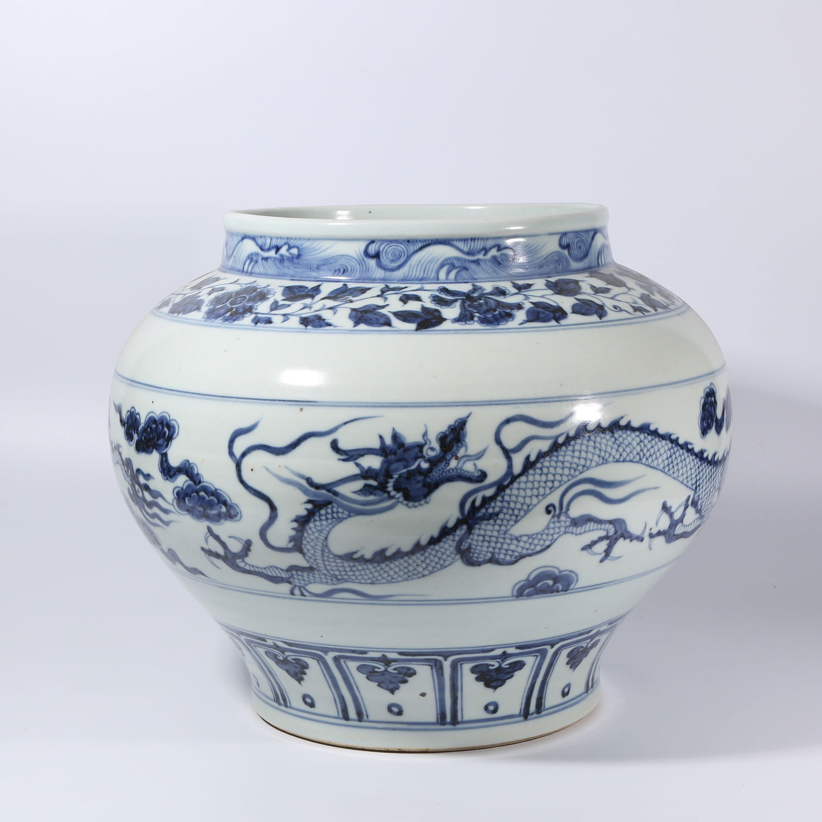 A BLUE-AND-WHITE CLOUD AND DRAGON PATTERN JAR: Blue-and-White Cloud and Dragon Pattern Jar