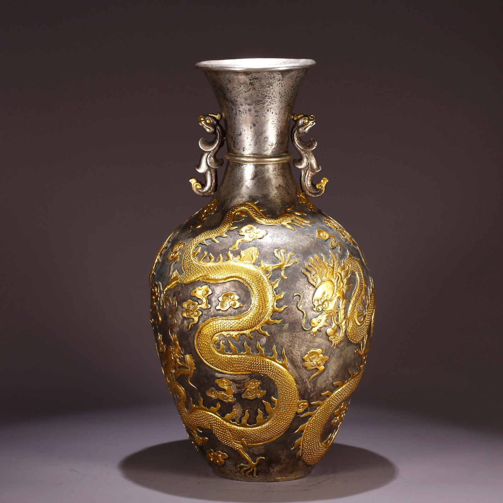 A GILT BRONZE DOUBLE-HANDLED VASE WITH CLOUD-DRAGON PATTERN: Gilt Bronze Double-Handled Vase with Cloud-Dragon Pattern