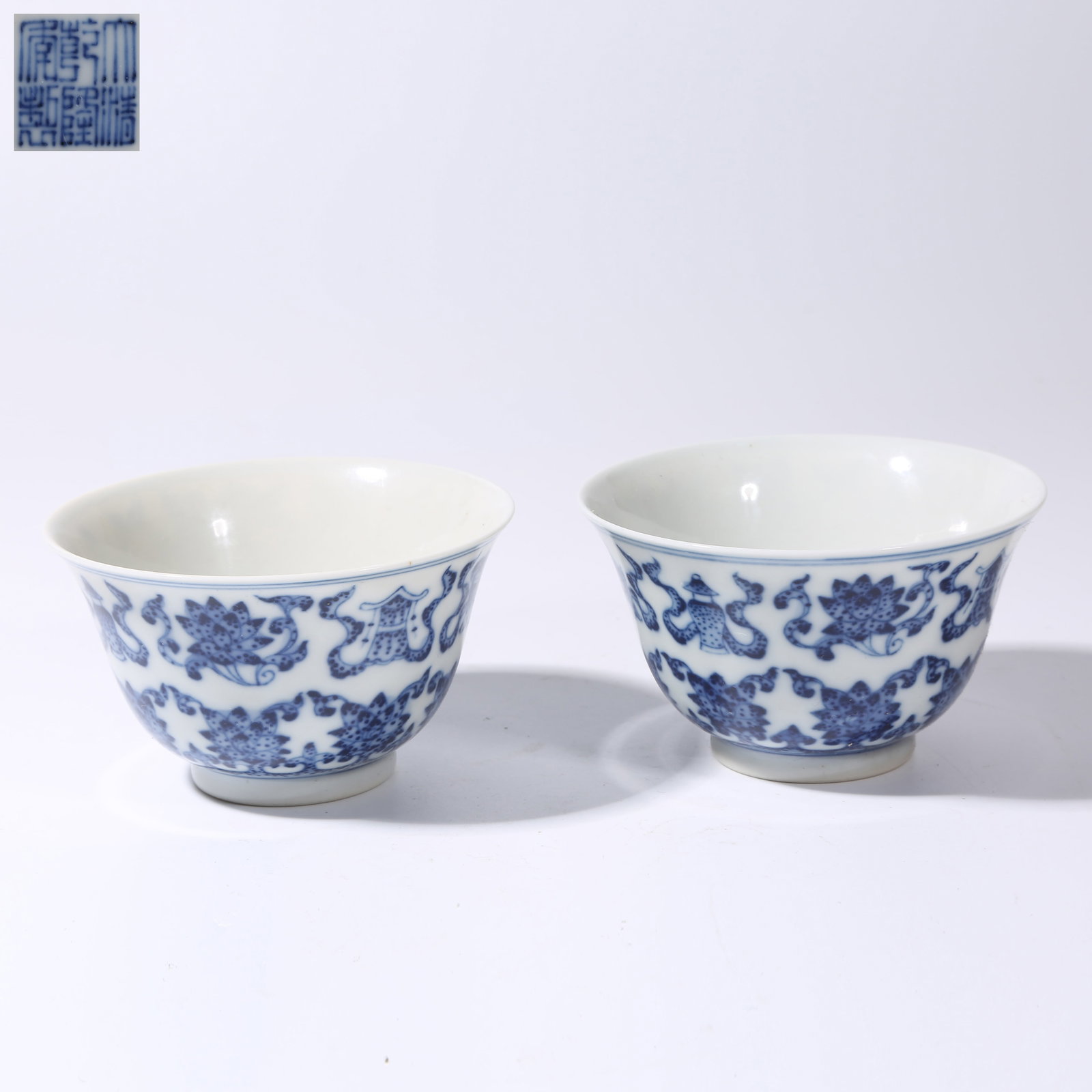A SET OF BLUE-AND-WHITE PASSIONFLOWER WITH EIGHT AUSPICIOUS SYMBOLS CUPS: Set of Blue-and-White Passionflower with Eight Auspicious Symbols Cups