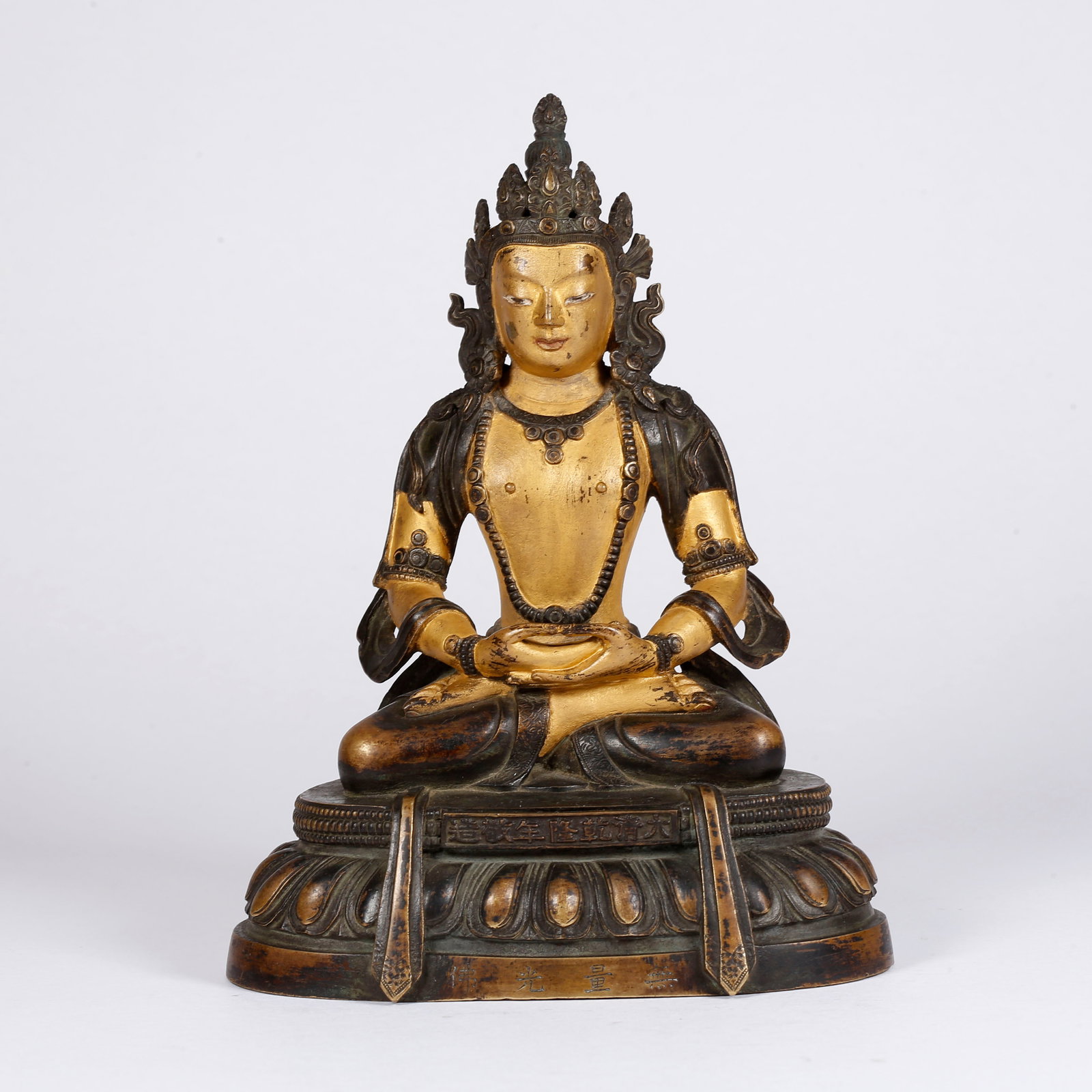 A PARTIALLY GILT BRONZE MEDICINE BUDDHA STATUE: Partially Gilt Bronze Medicine Buddha Statue