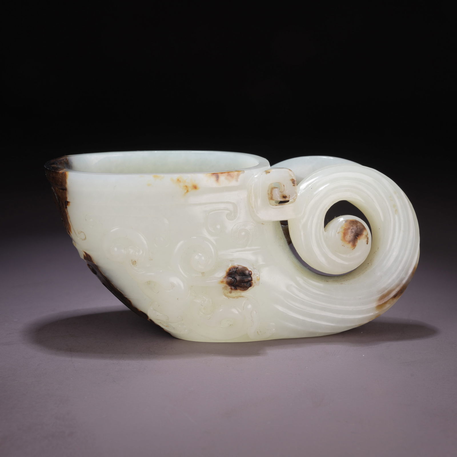 A HIGH-ANTIQUITY JADE JUE CUP WITH CHI-DRAGON MOTIF: High-Antiquity Jade Jue Cup with Chi-Dragon Motif