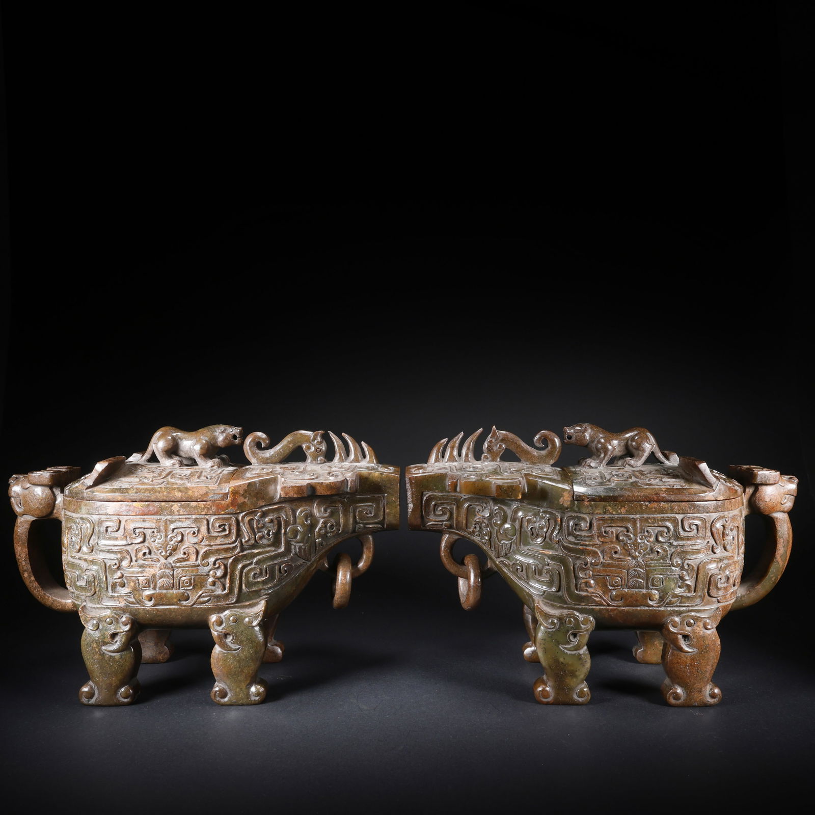 A PAIR OF HETIAN JADE FOUR-FOOTED HORN CUPS WITH MOVABLE RINGS AND BEAST FACES: Pair of Hetian Jade Four-Footed Horn Cups with Movable Rings and Beast Faces