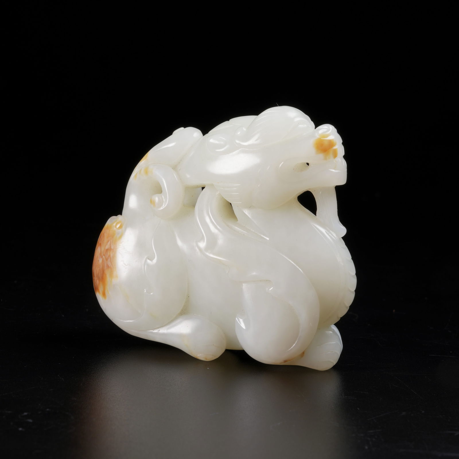 A HETIAN JADE AUSPICIOUS BEAST ORNAMENT: Hetian Jade Auspicious Beast Ornament