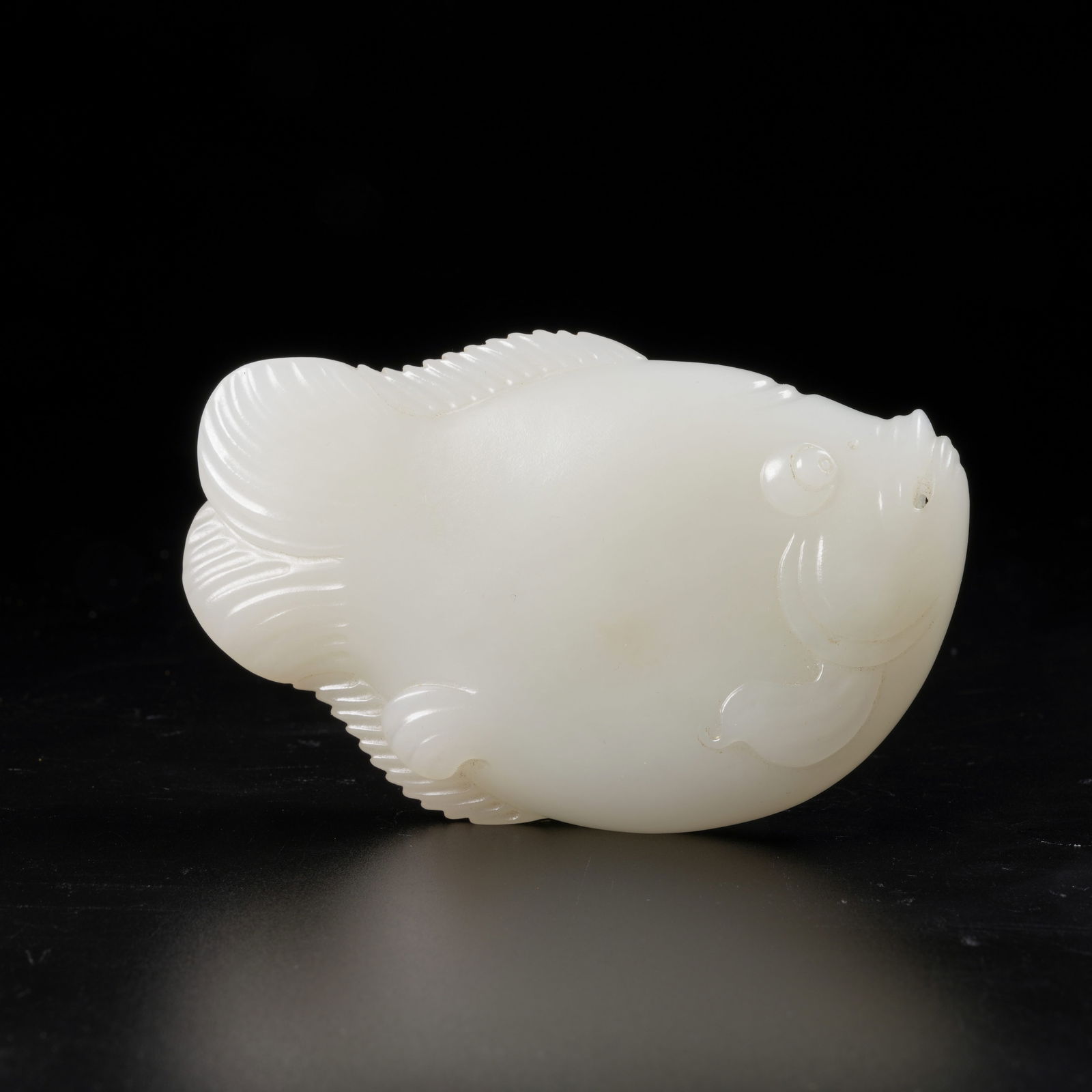 A HETIAN WHITE JADE FISH PENDANT: Hetian White Jade Fish Pendant