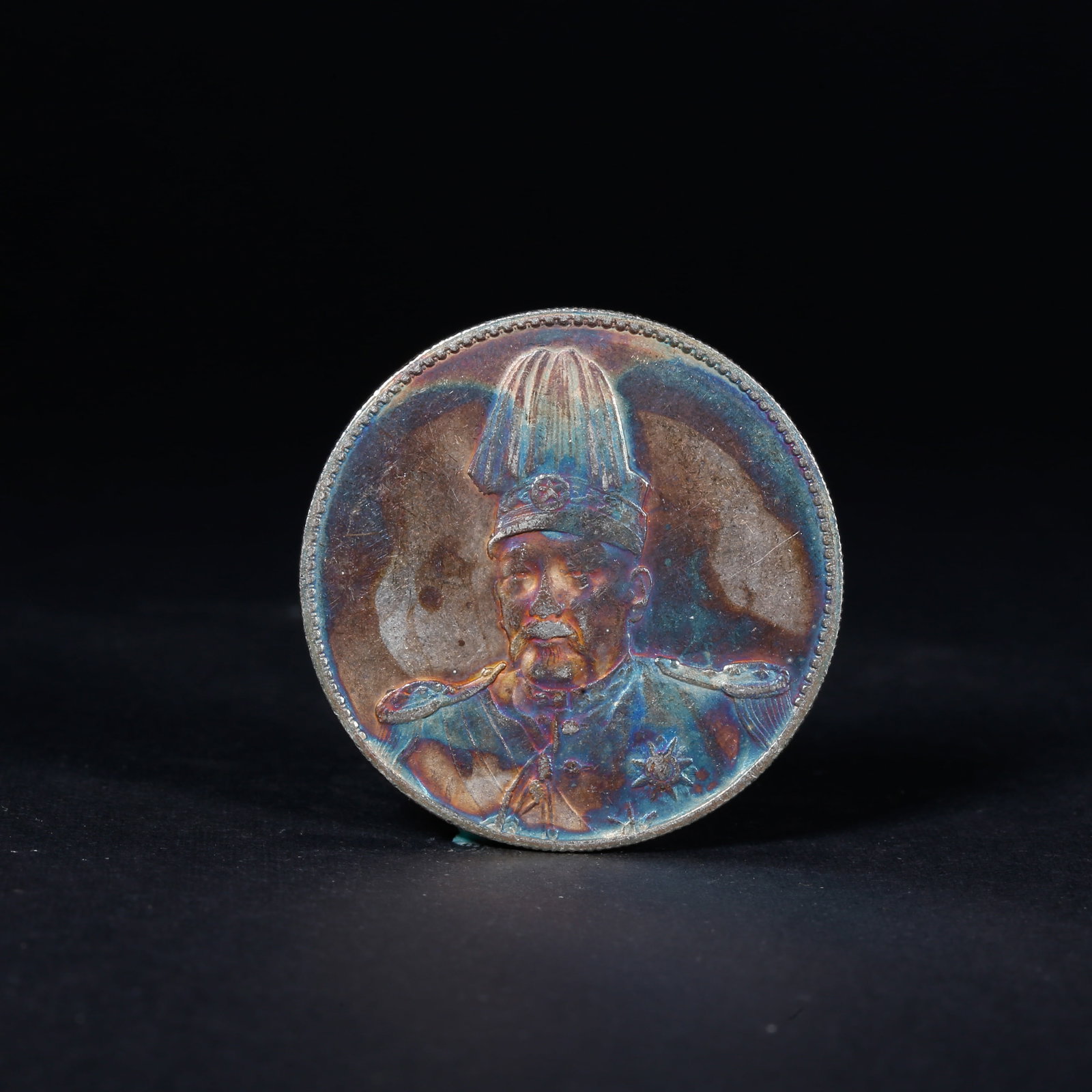 A SILVER DOLLAR COIN: One Silver dollar Coin