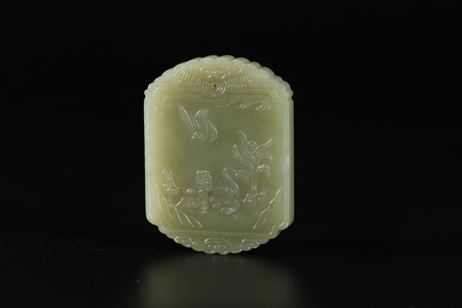 A HETIAN YELLOW JADE CARVED BEAST-FORM PLAQUE (1 of 10)