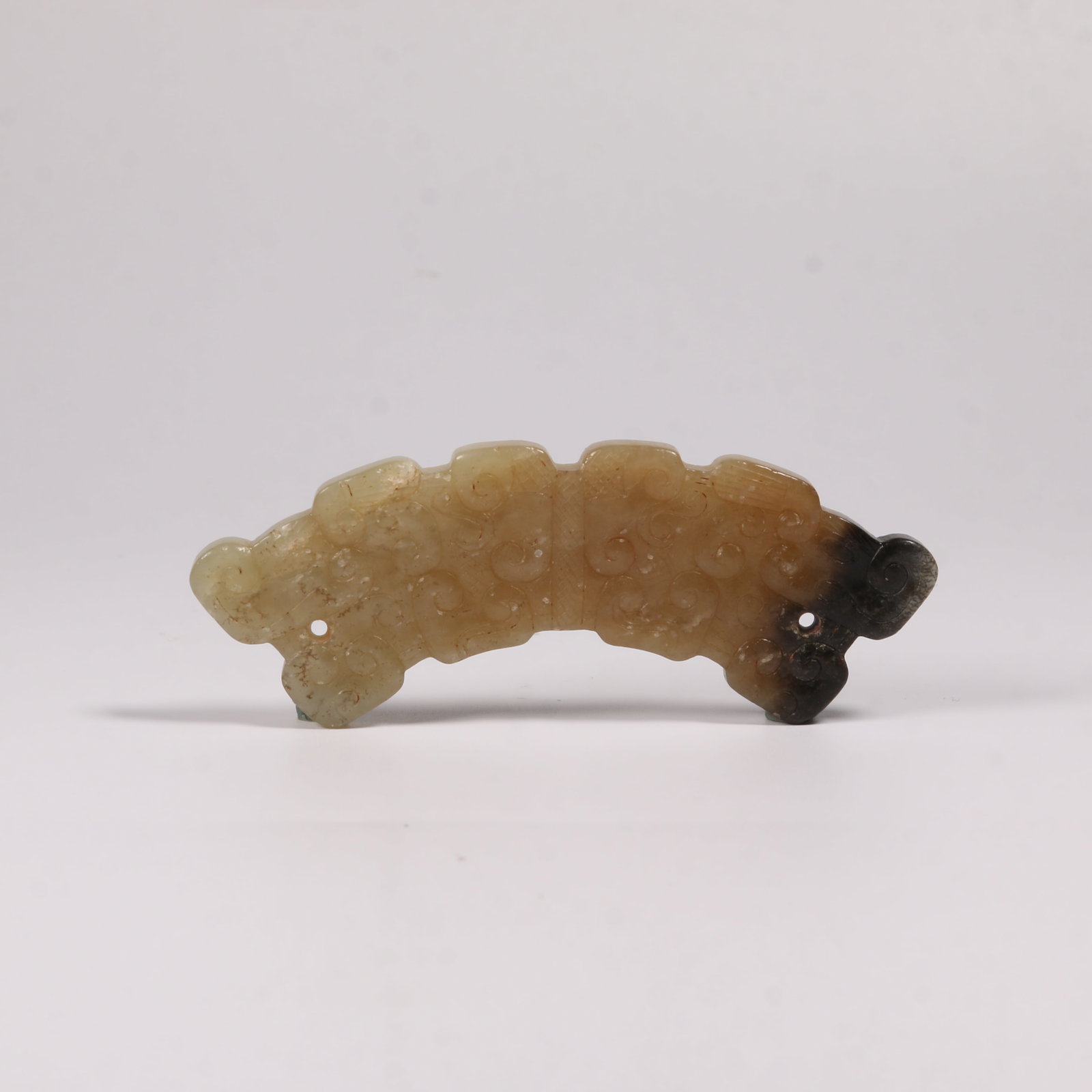A HETIAN JADE DRAGON-PATTERN HUANG PENDANT (1 of 6)