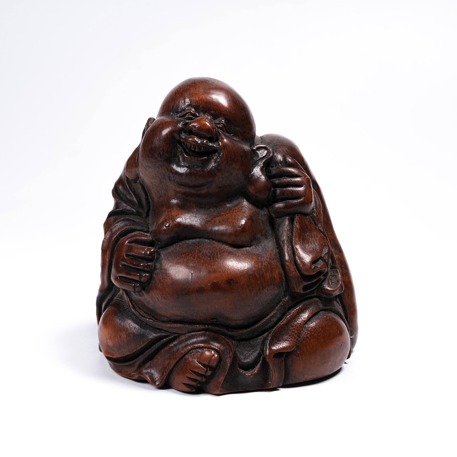 A BAMBOO ROOT CARVED BUDAI (LAUGHING BUDDHA) FIGURE (1 of 8)