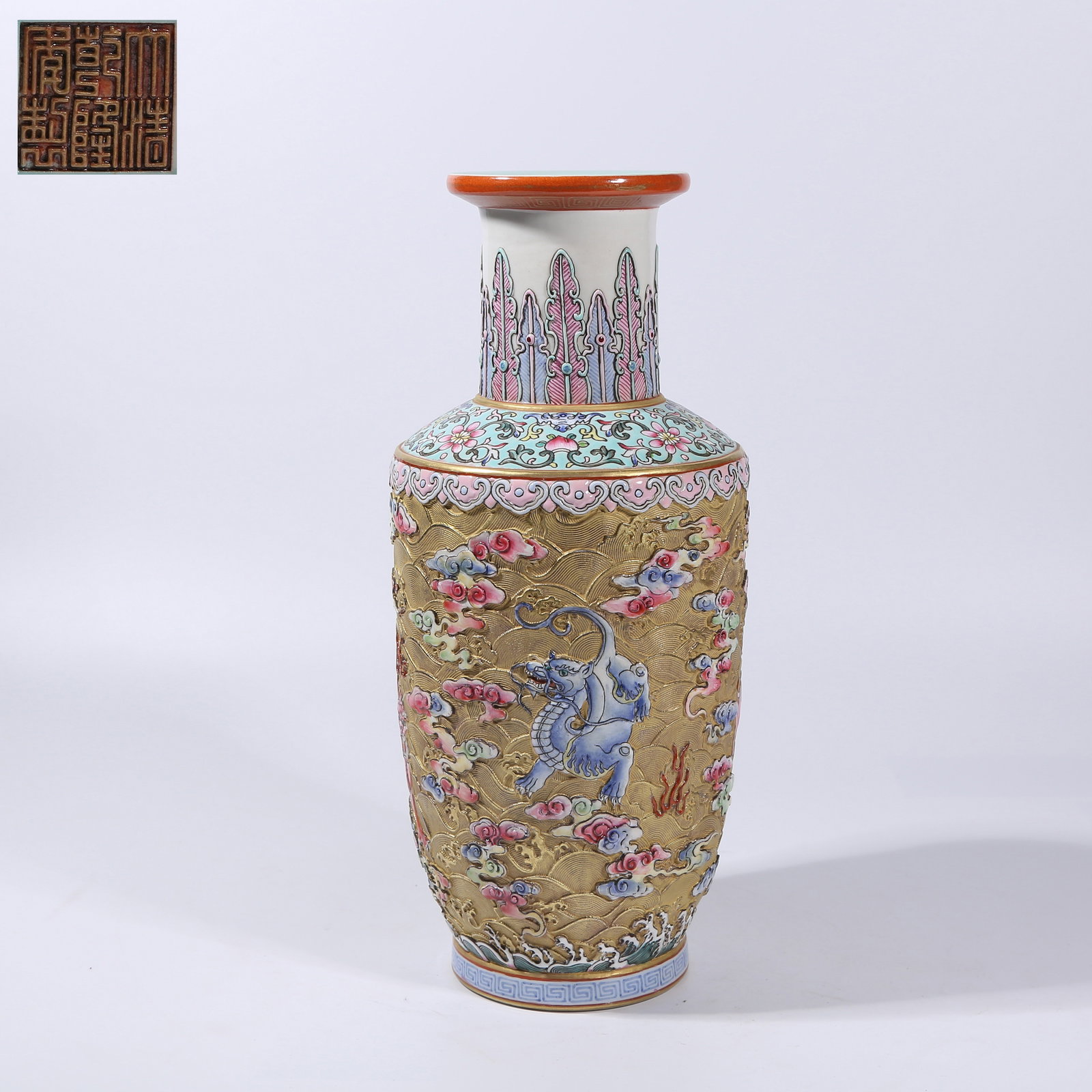 A CARVED PORCELAIN FAMILLE ROSE "SEA BEAST" CLUB-SHAPED VASE: Carved porcelain famille rose "sea beast" club-shaped vase