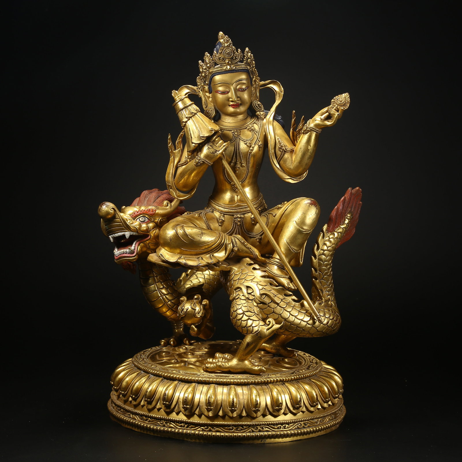 A GILT BRONZE STATUE OF WHITE UMBRELLA MOTHER BUDDHA: Gilt bronze statue of White Umbrella Mother Buddha