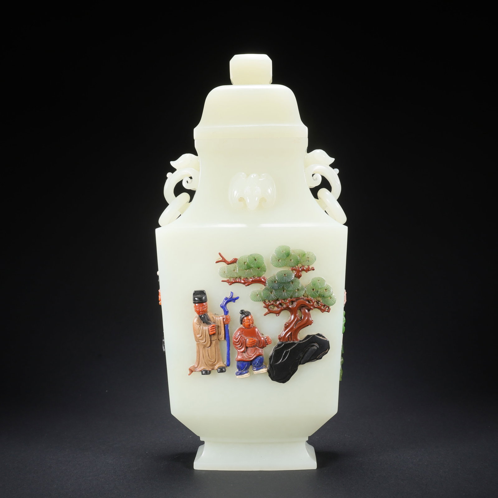 A HETIAN JADE COVERED VASE WITH INLAID PRECIOUS STONES, FIGURES, AND DOUBLE RING RUYI HANDLES (1 of 9)