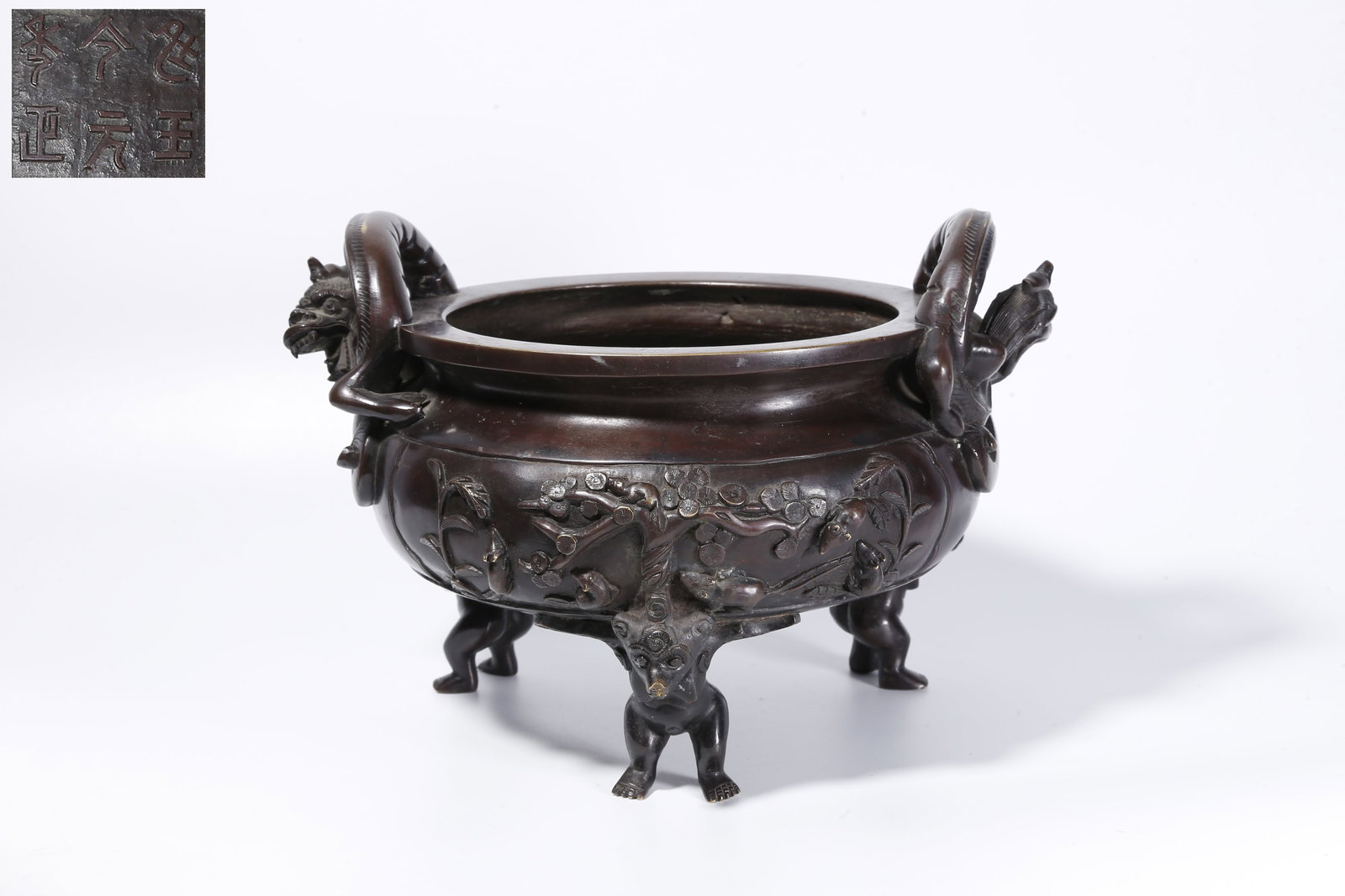 A BRONZE TRIPOD INCENSE BURNER WITH DOUBLE DRAGON HANDLES: Bronze Tripod Incense Burner with Double Dragon Handles