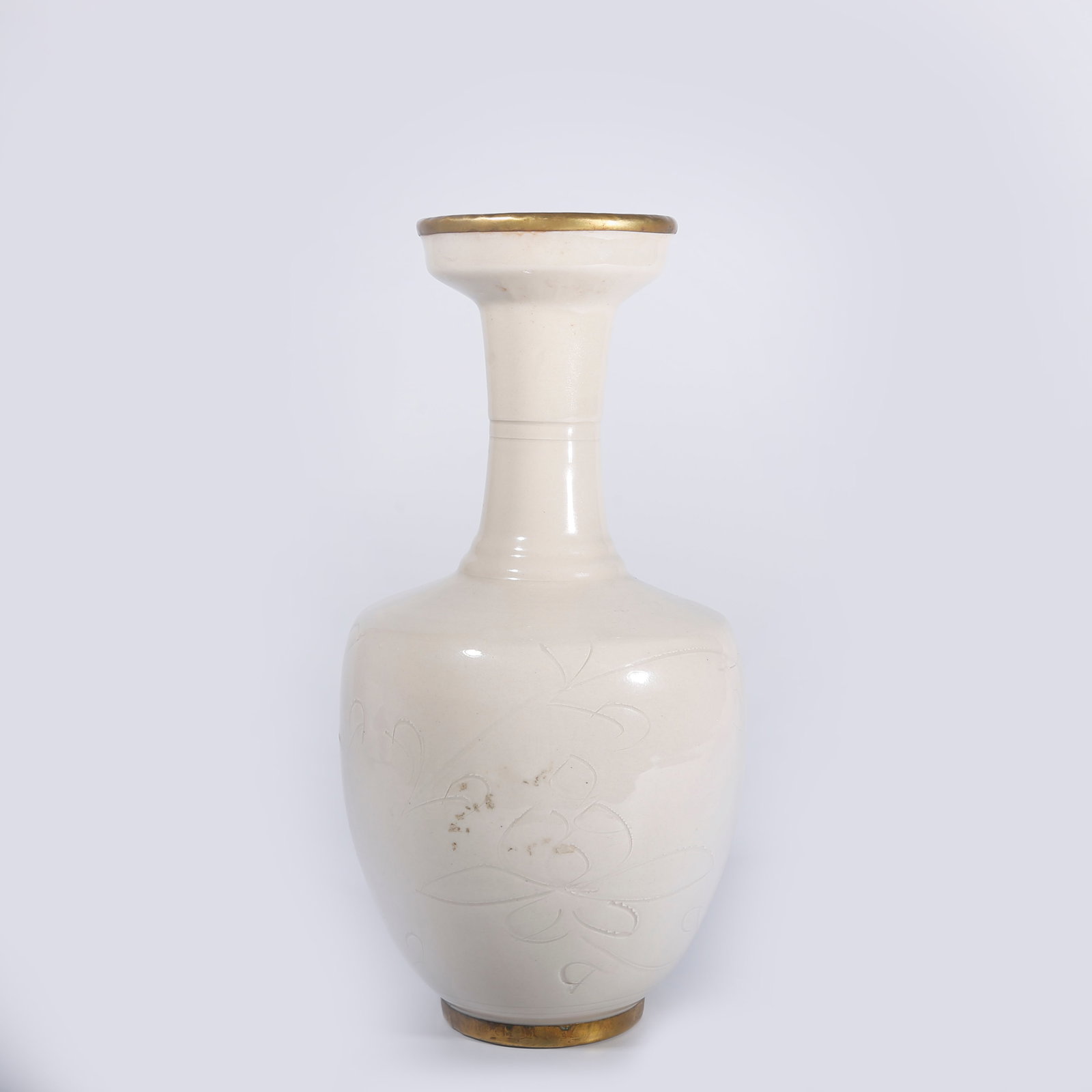 A DING KILN DARK-CARVED LOTUS MOTIF MOUTH-PIECE VASE (1 of 9)